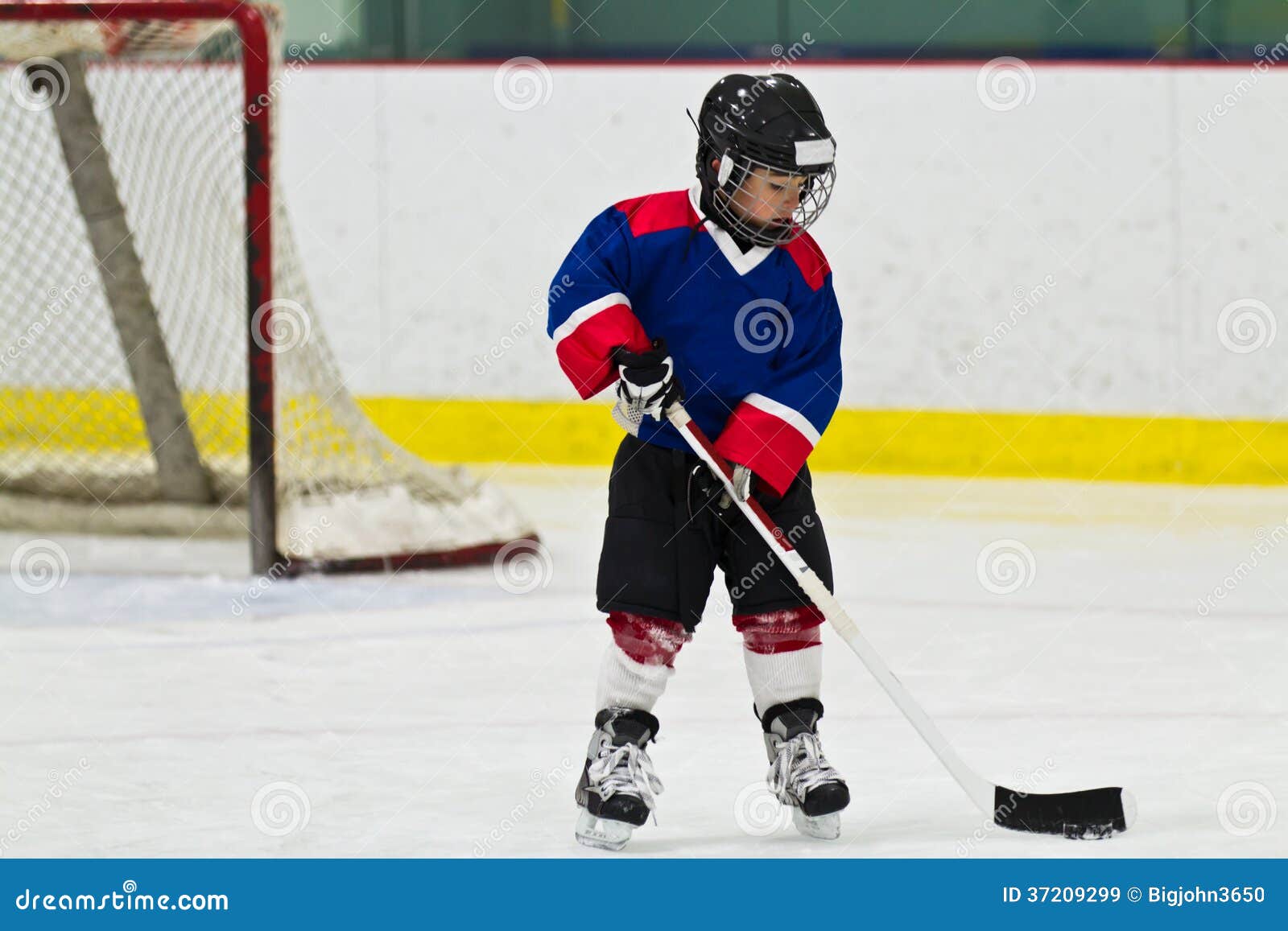 Child Skating with a Puck at Ice Hockey Practice Stock Image Image of sport, fitness 37209299