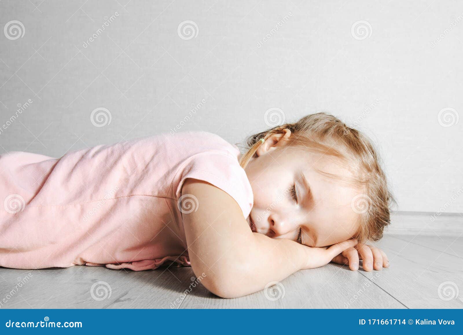 A Child Sleeping On The Floor Stock Photo Image Of Resting