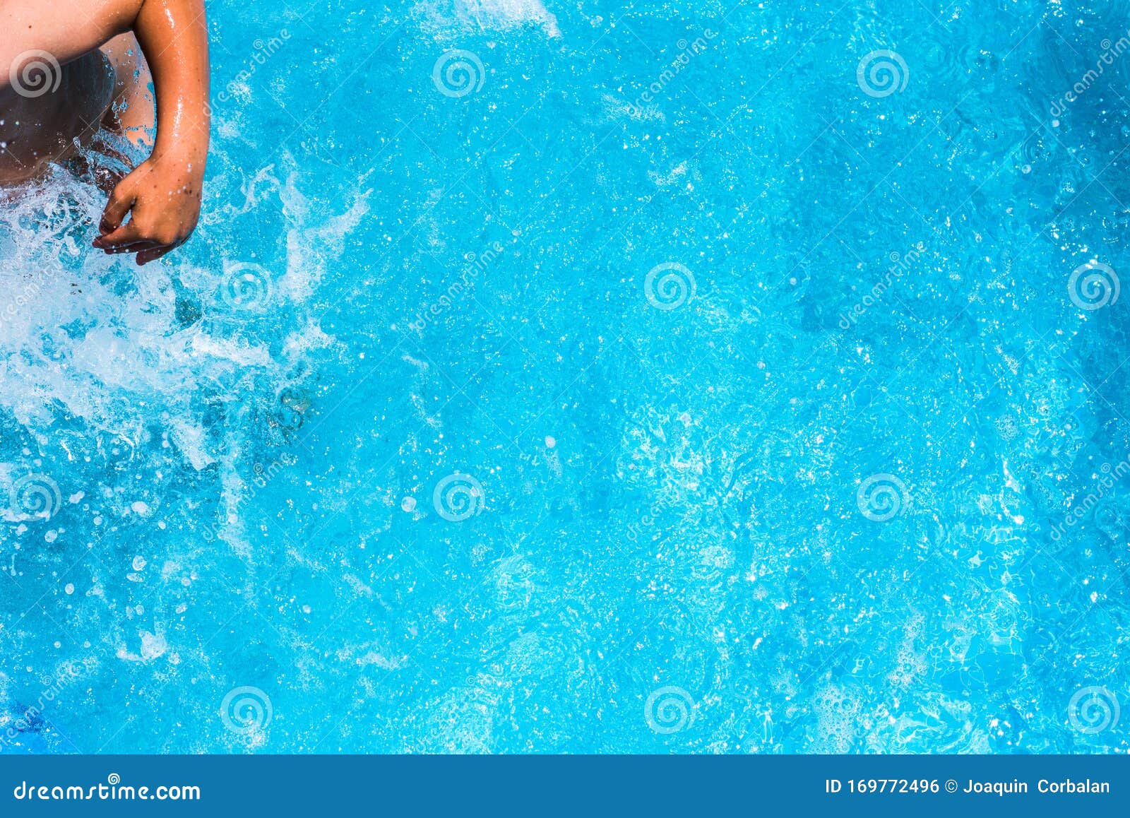 Child Splashing in the Cool Water of a Pool in Summer Stock Photo ...