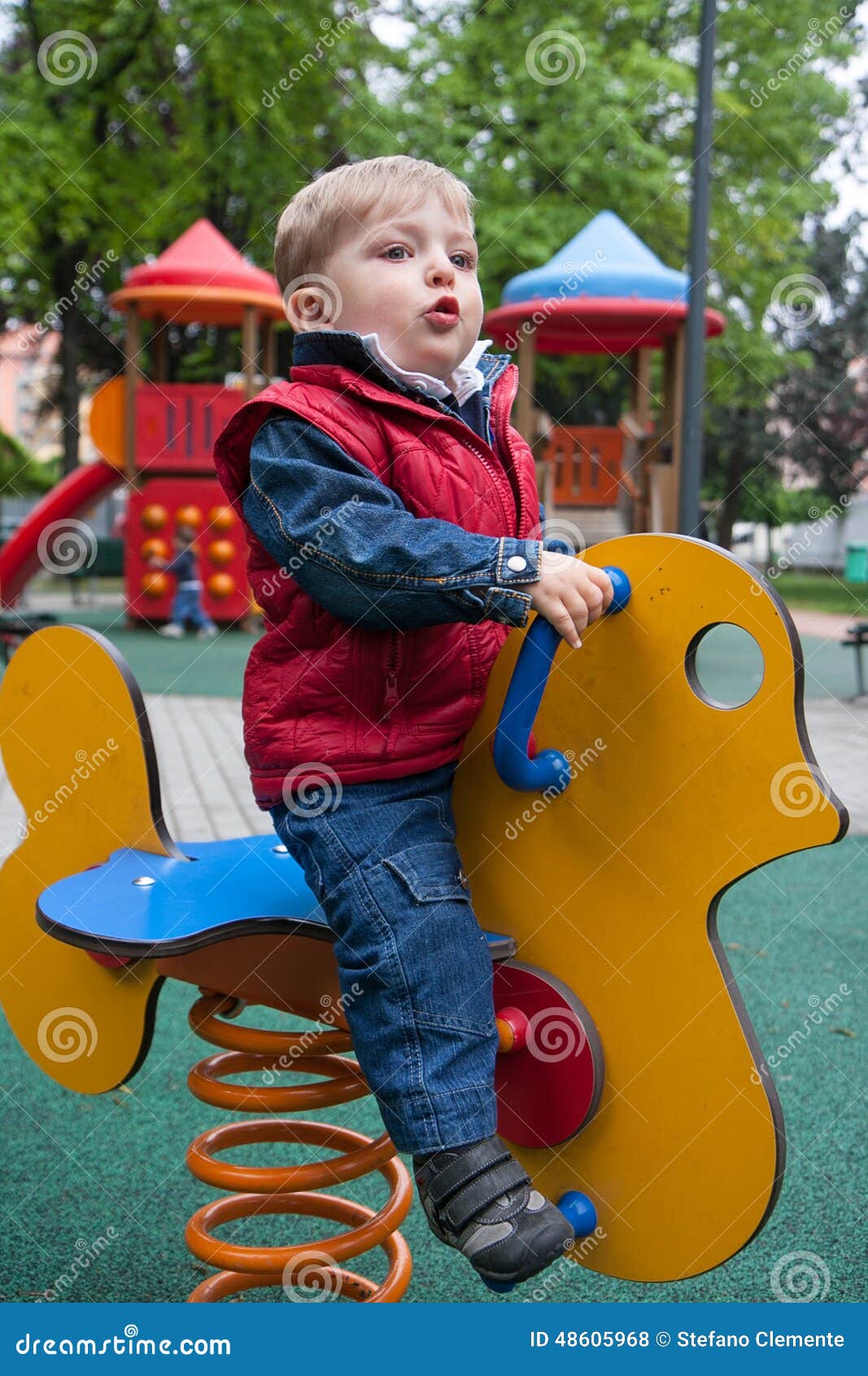 Child on a spring horse stock photo. Image of youngster 48605968