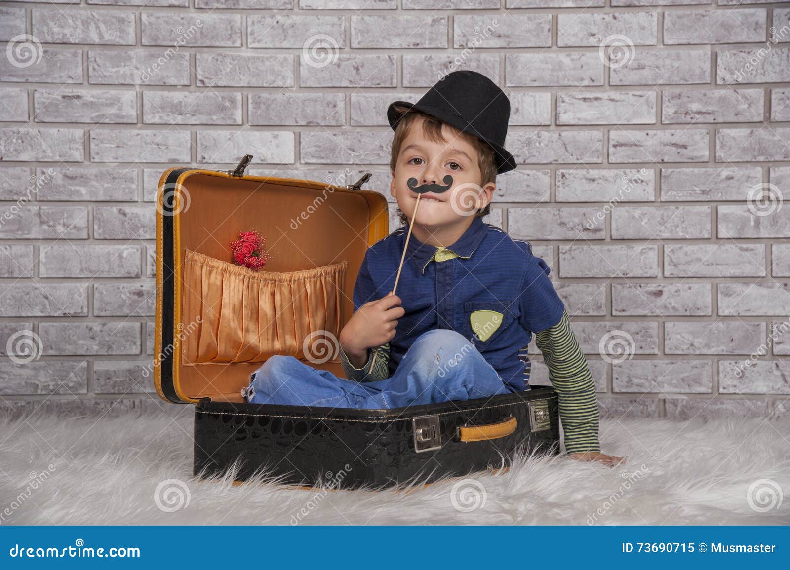 A child in a suitcase. stock image. Image of packing 73690715