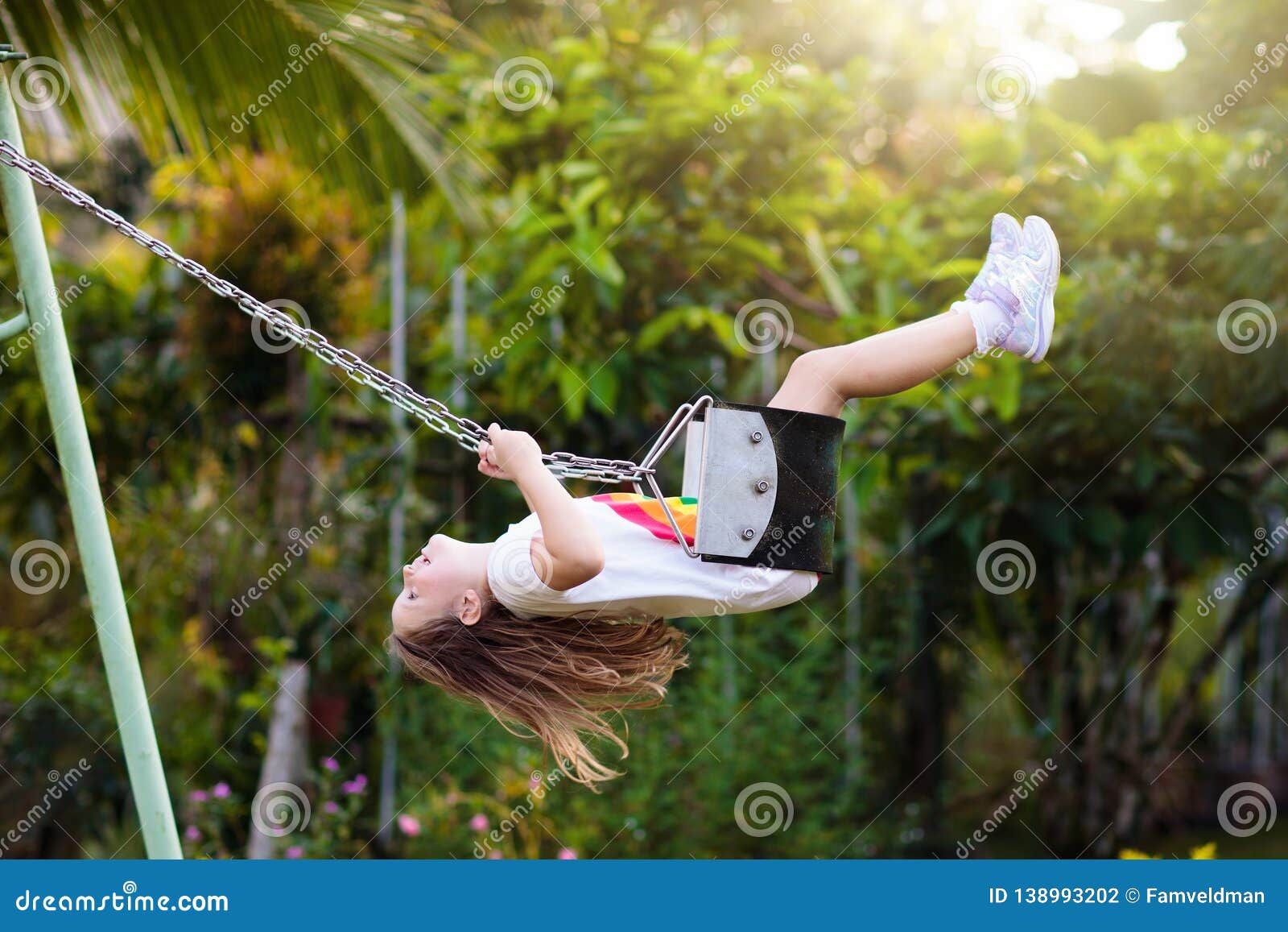 Child Swinging on Pla photo