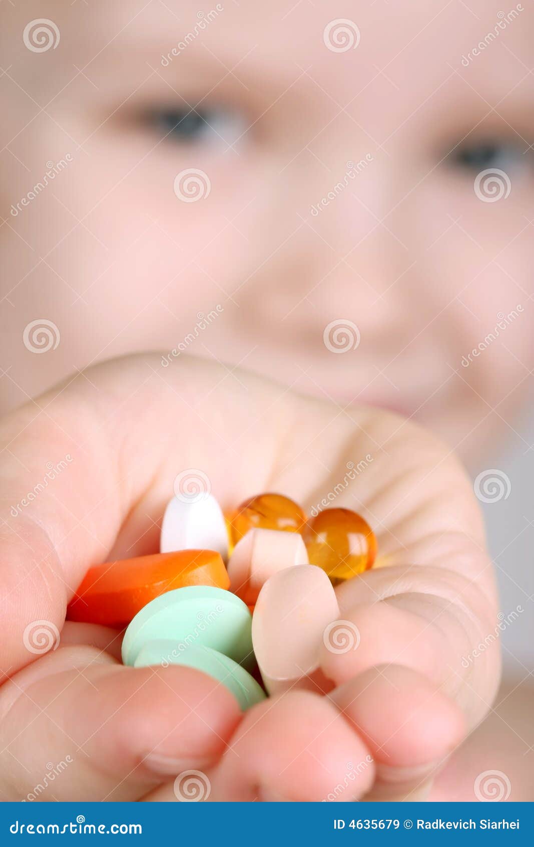 Child takes vitamins stock image. Image of little, hand 4635679
