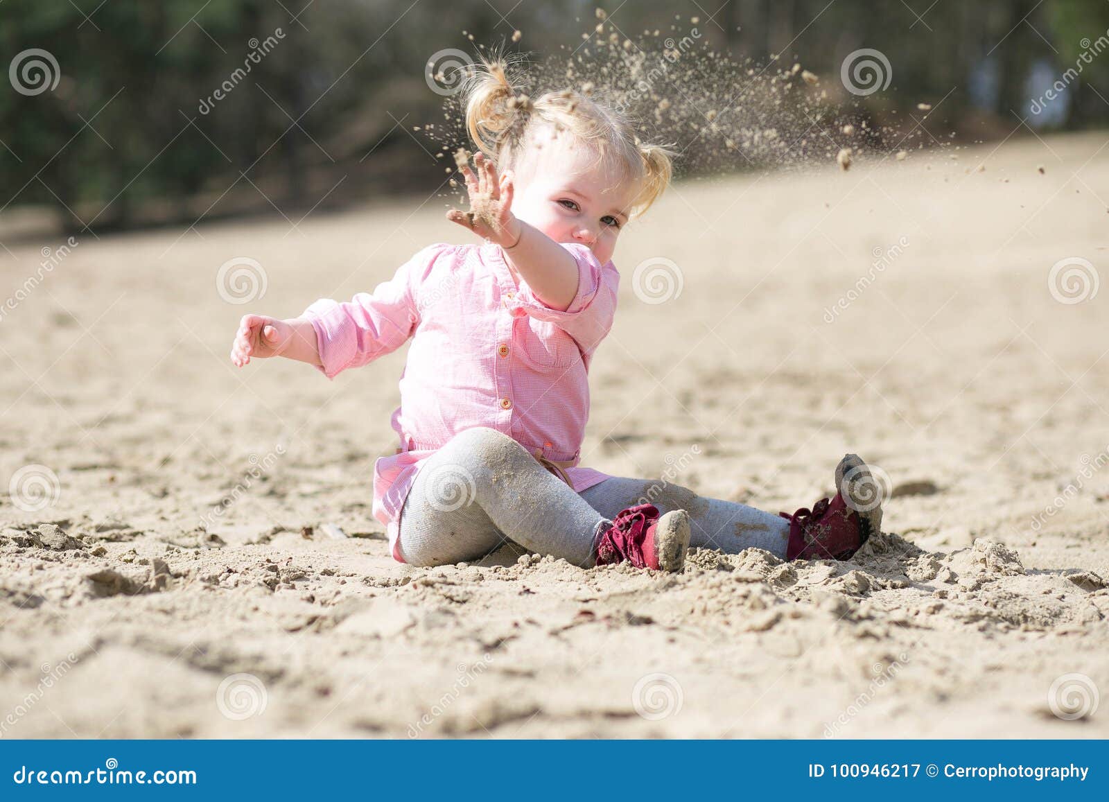 Child throwing sand stock image. Image of caucasian 100946217