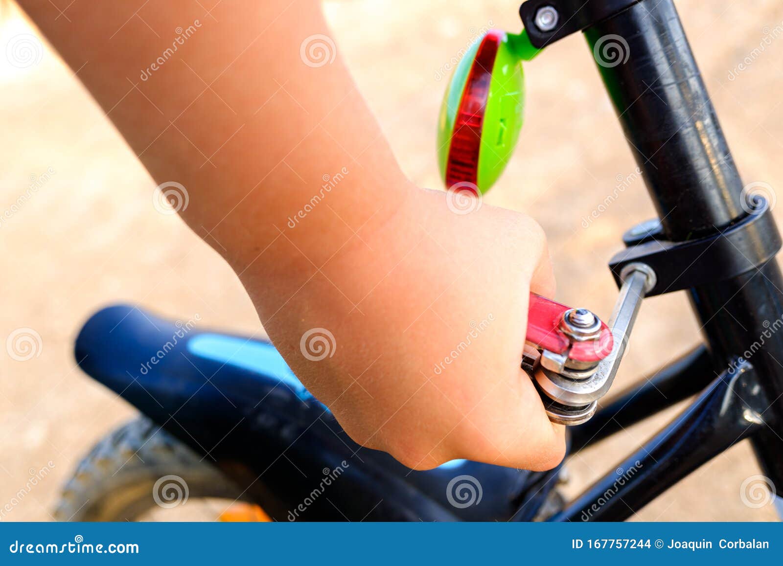 Child Tightened the Saddle Nuts of His Bicycle Stock Photo Image of
