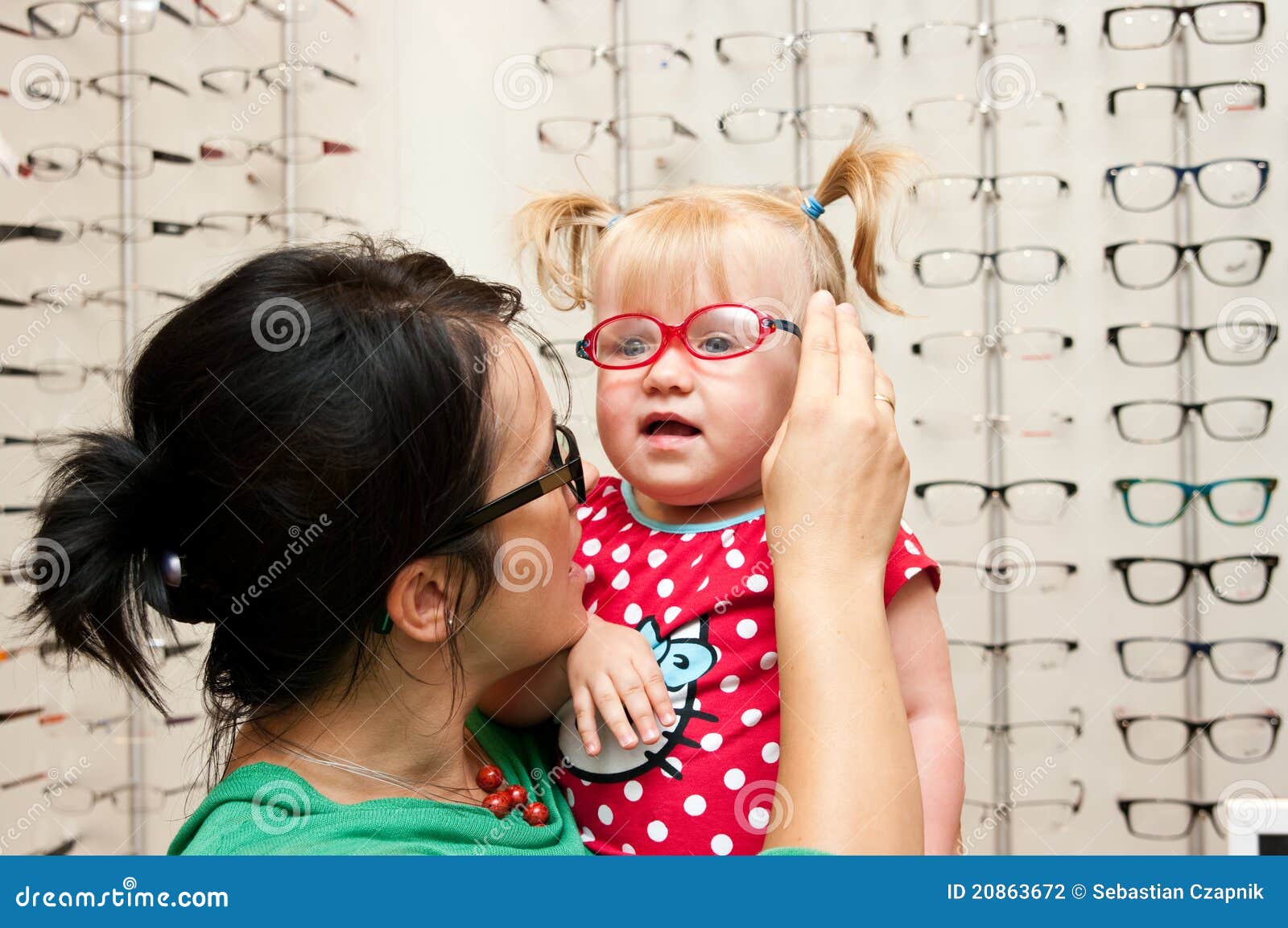 Child trying on eyeglasses stock photo. Image of eyeglasses 20863672