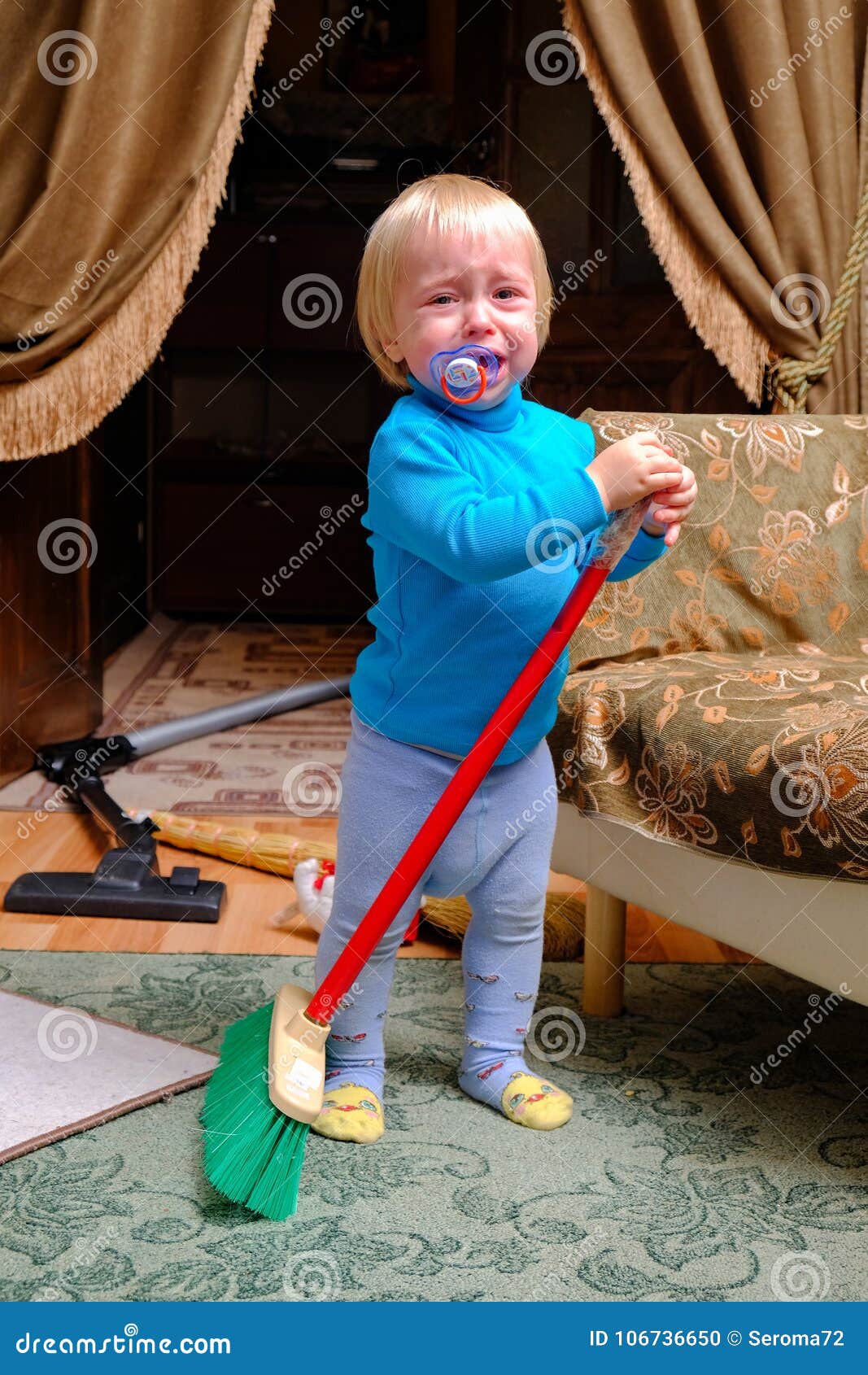 Child vacuuming a room stock photo. Image of family - 106736650