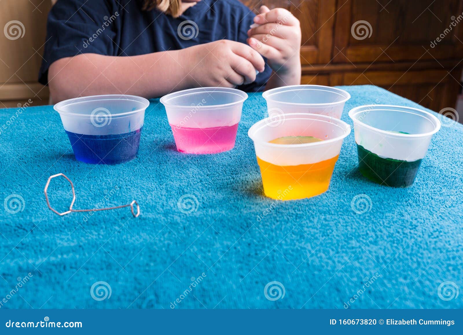 Child Waiting for Dye Tablets To Dissolve for Easter Egg Dyeing Stock ...