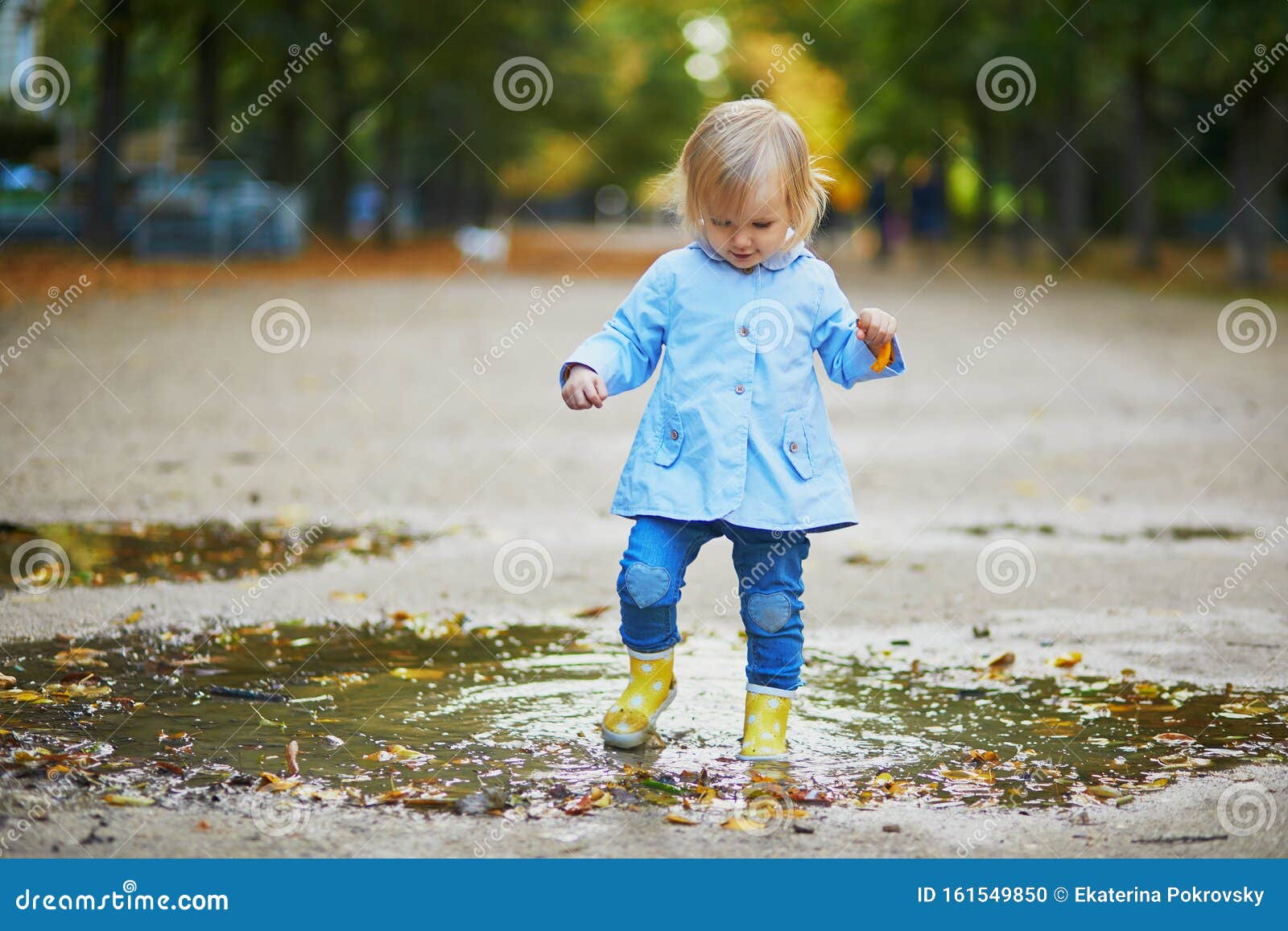Child Wearing Yellow Rain Boots and 