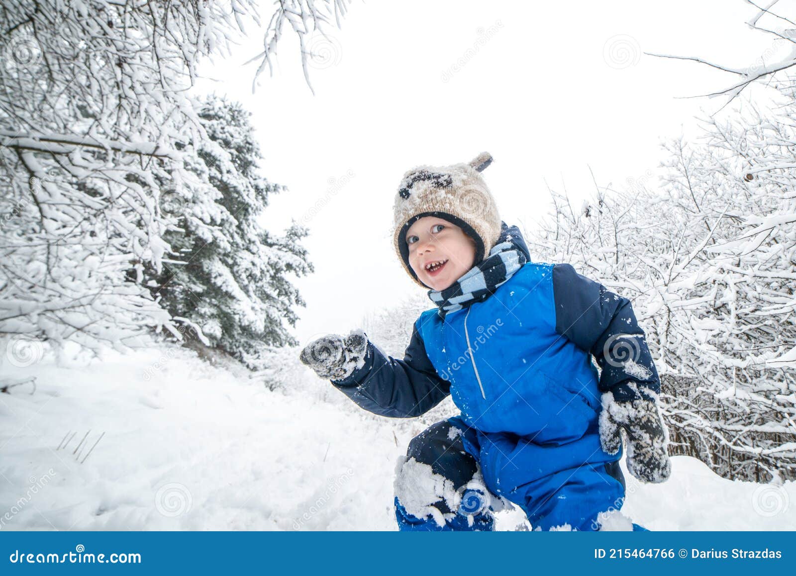 child in winter, happy face