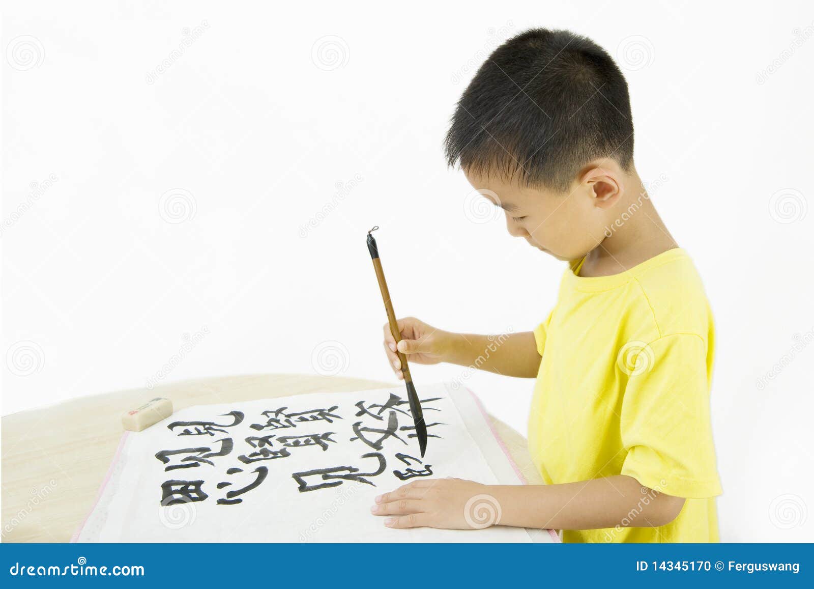 a child writing chinese calligraphy