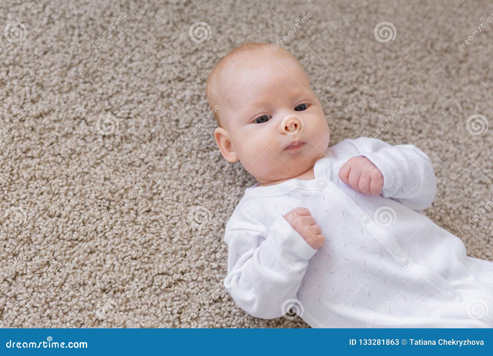 Childhood, Infant and People Concept - Small Baby Lying on the Floor ...