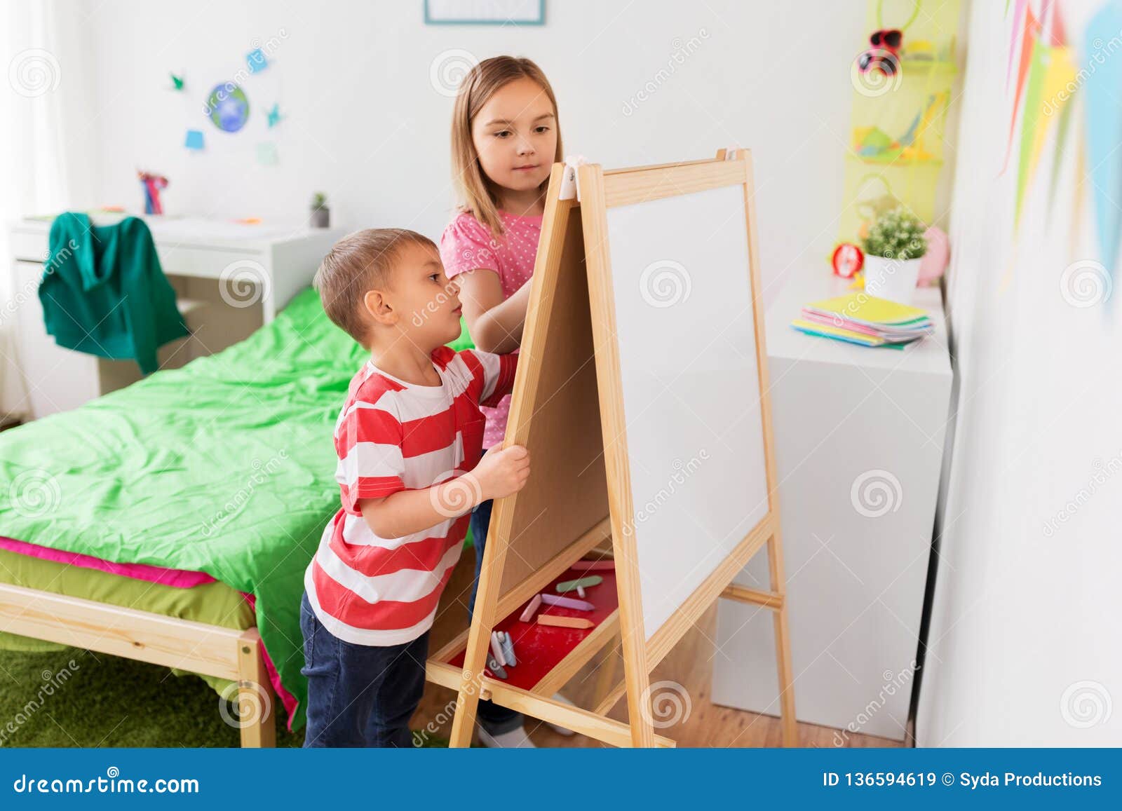 Happy Kids Drawing On Easel Or Flip Board At Home Stock Image