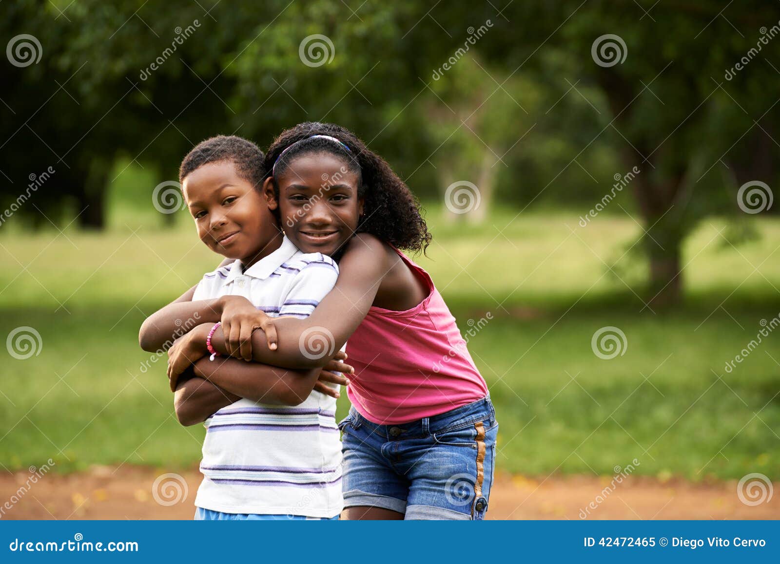 children african boy and girl in love hugging