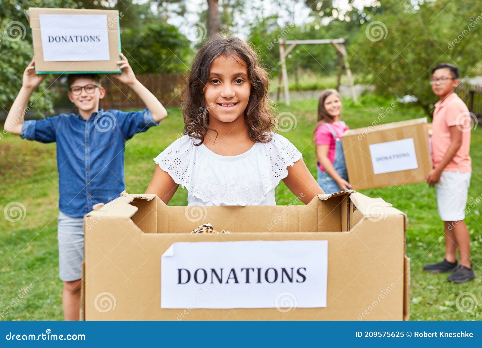 Children Collecting Donations for Clothing Collection Stock Image