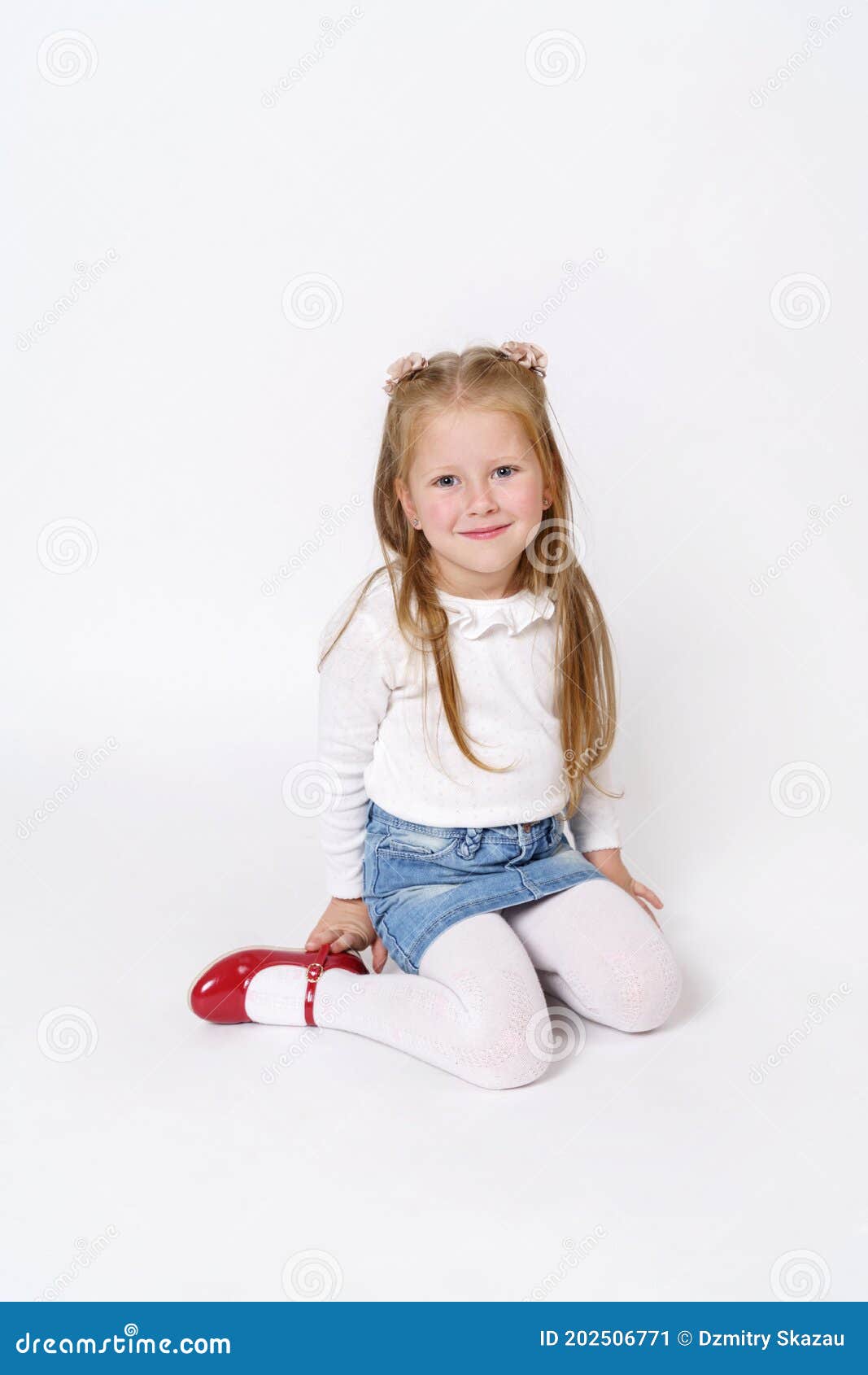The Girl is Sitting on the Floor. Isolated Over White Background Stock ...