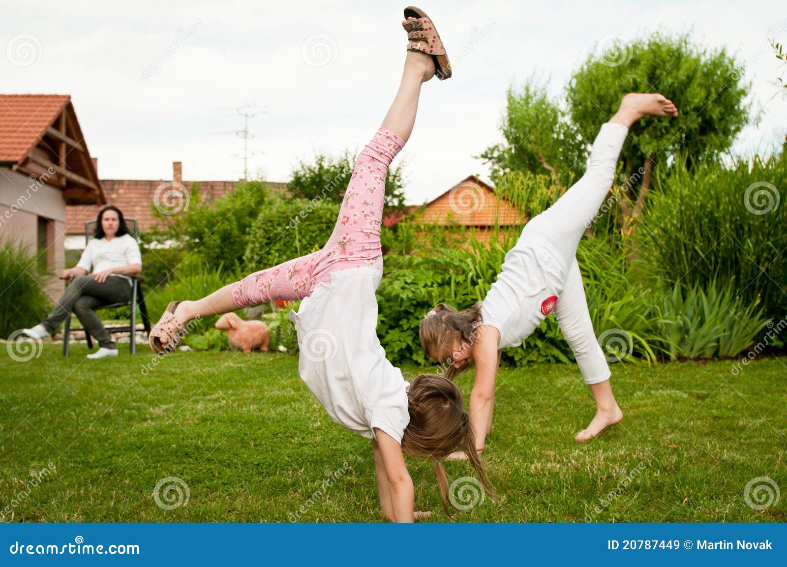 Children Doing Cartwheels in Backyard Stock Image Image of hands