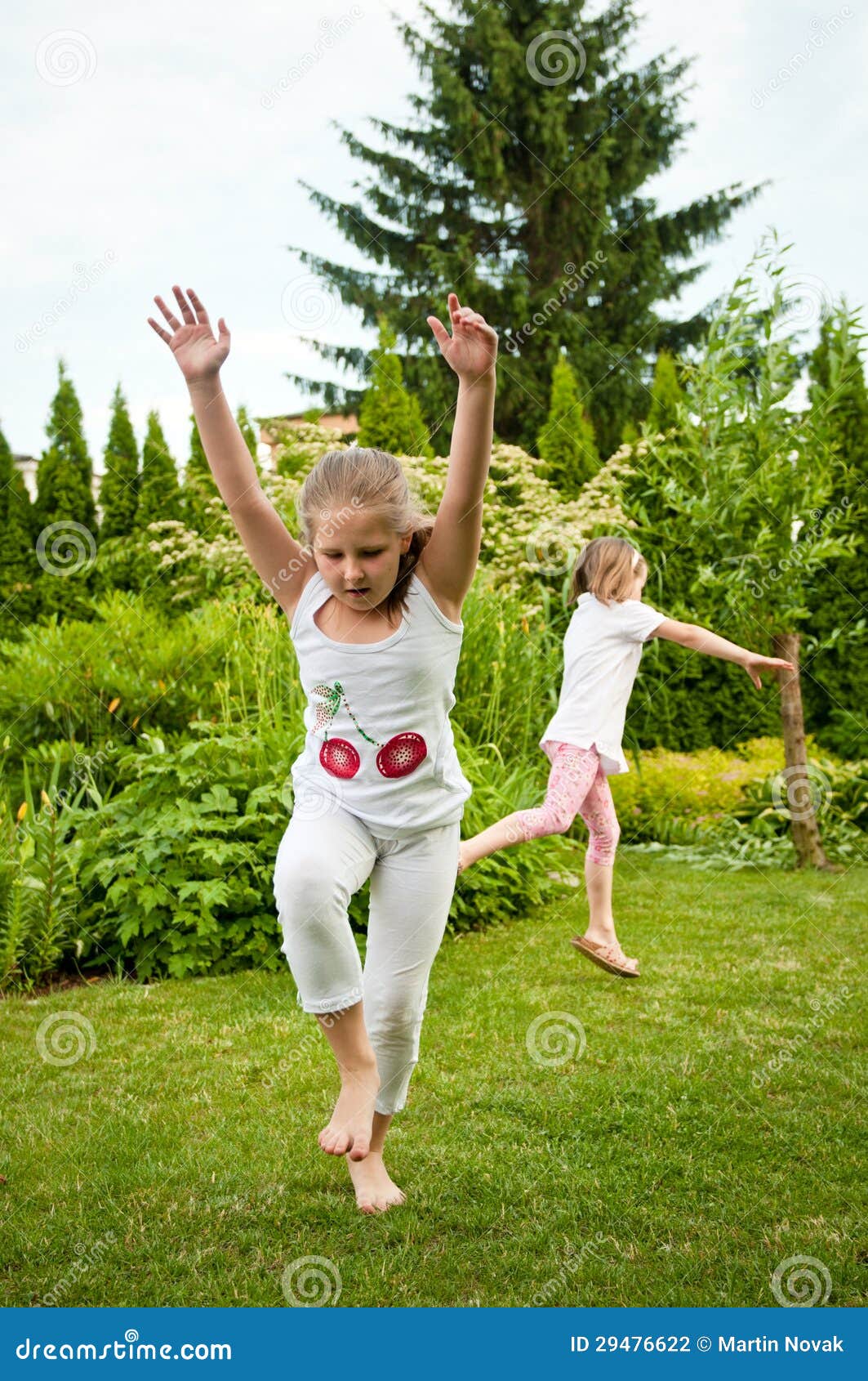 Children Doing Cartwheels in Backyard Stock Photo Image of outdoors