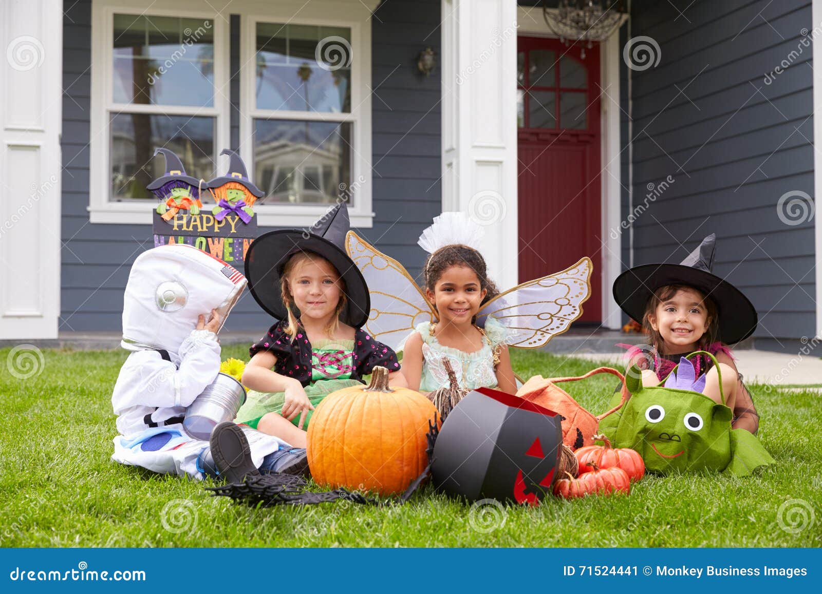 Children Dressed in Trick or Treating Costumes on Lawn Stock Image ...