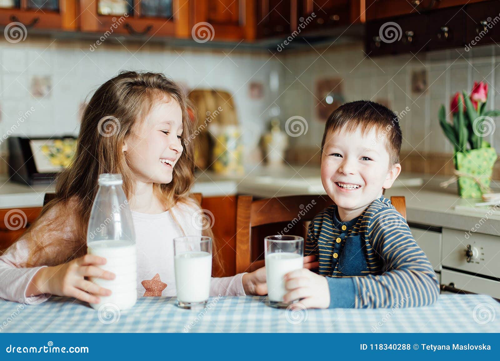 Children Drink Milk and Have Fun in the Kitchen at the Morning. Sister and  Brother Prepare Cocoa Stock Photo - Image of cosiness, brother: 118340288