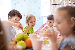 Children Eat Cake At Birthday Party Stock Photo Image Of Childhood 