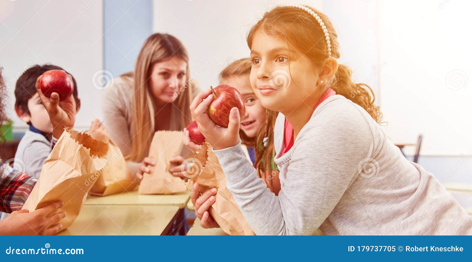 Children Eat Fruit As a Snack during Elementary School Break Stock