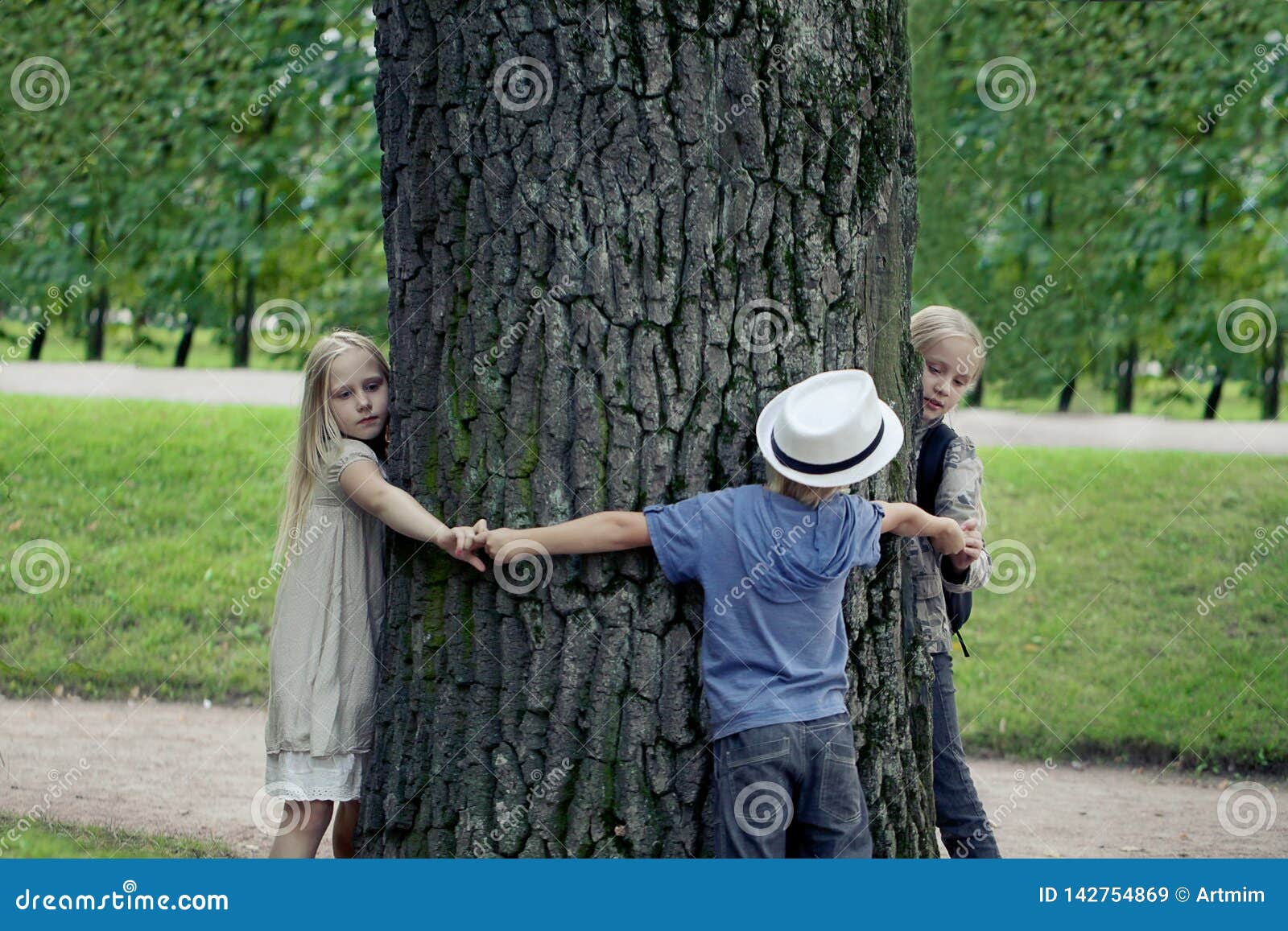 Children Embracing Tree. Environmental Protection Outdoor Nature Stock