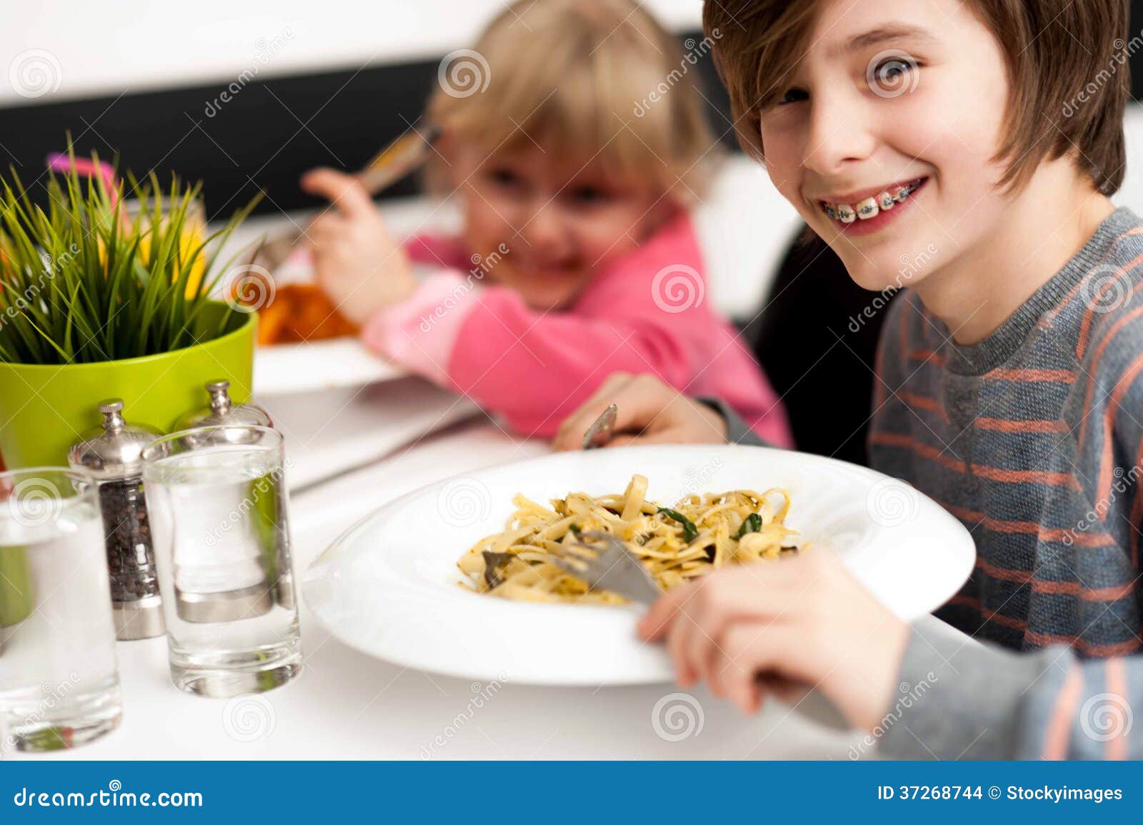 Children Enjoying Their Meals Stock Photo - Image of little, childhood