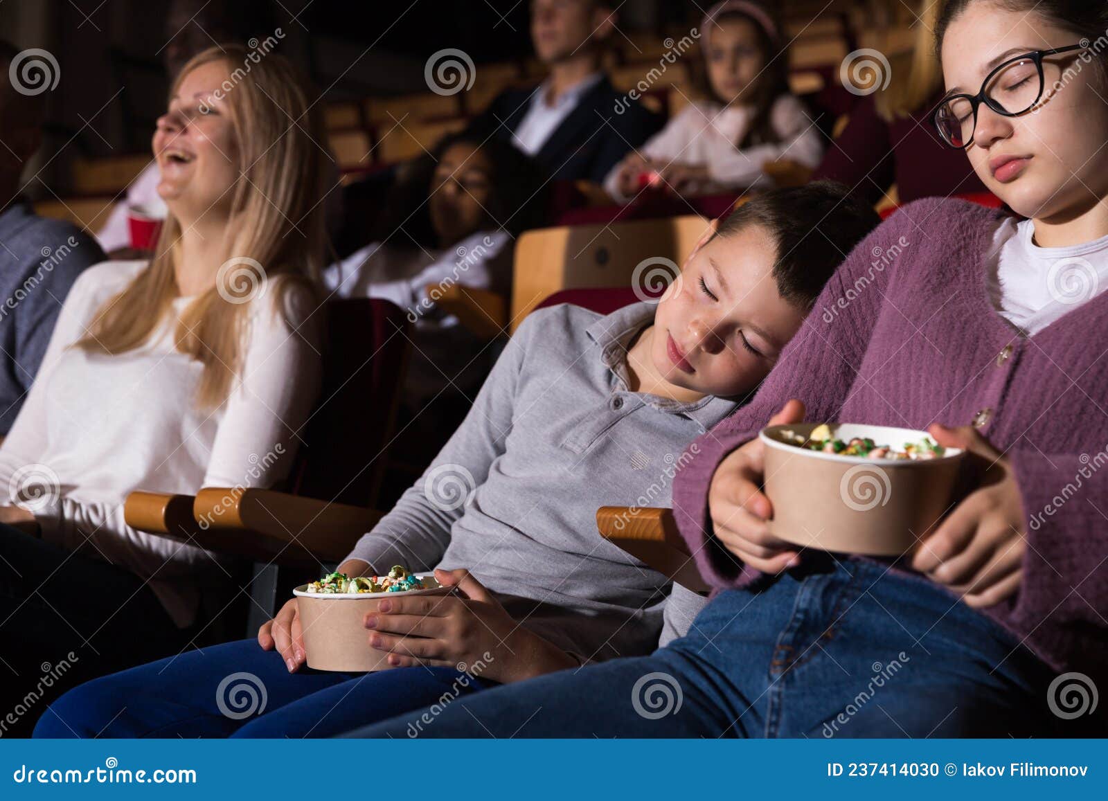 Children Fell Asleep while Watching a Movie in the Auditorium of Cinema