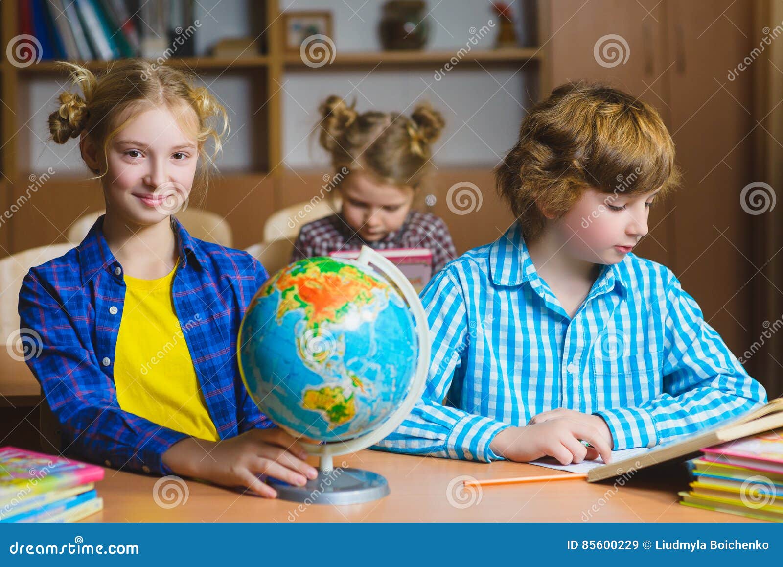 Children on the Geography Lesson in School Classroom. Educational