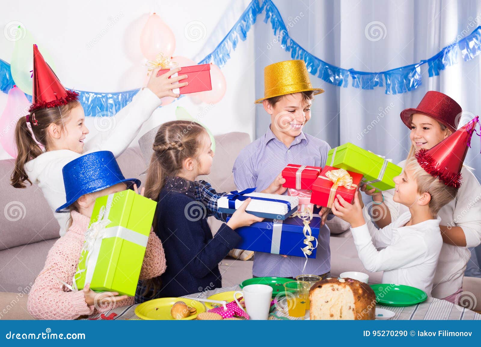 Children Giving Presents To Little Boy during Party Stock Photo - Image ...