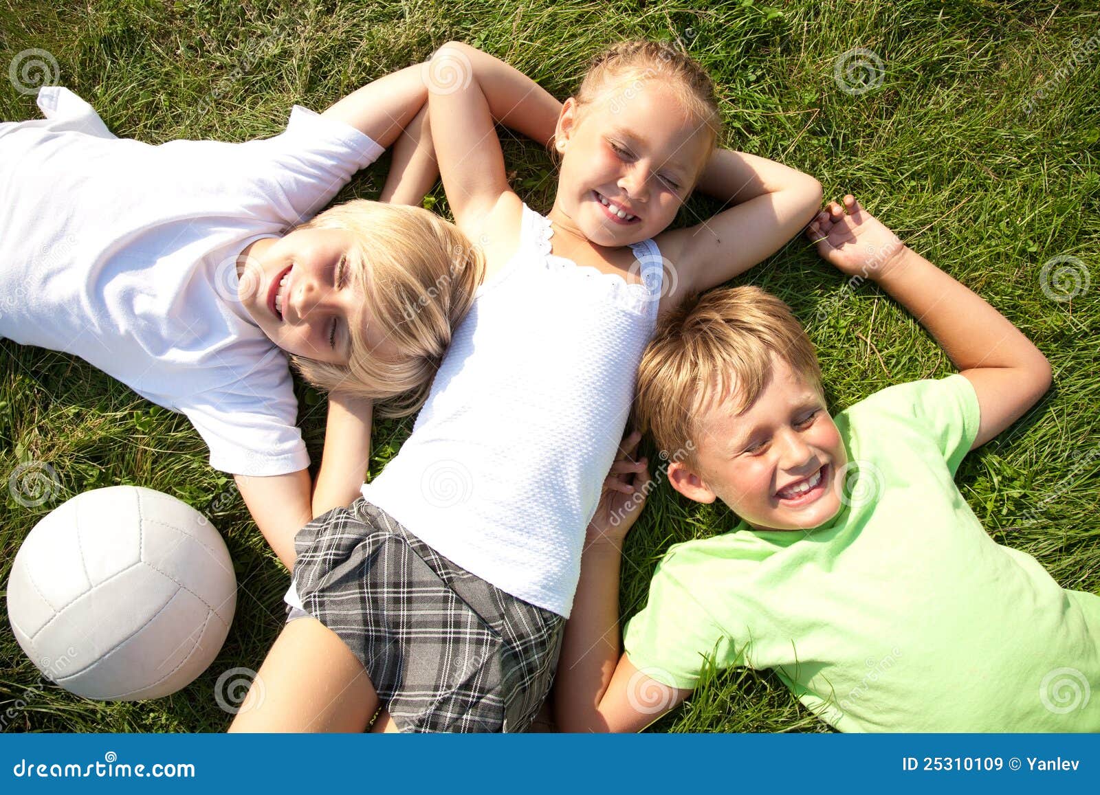 Children on grass stock image. Image of friendship, lying - 25310109