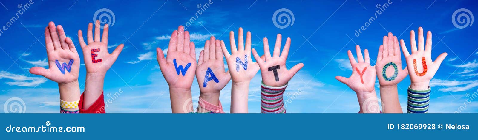 children hands building word we want you, blue sky
