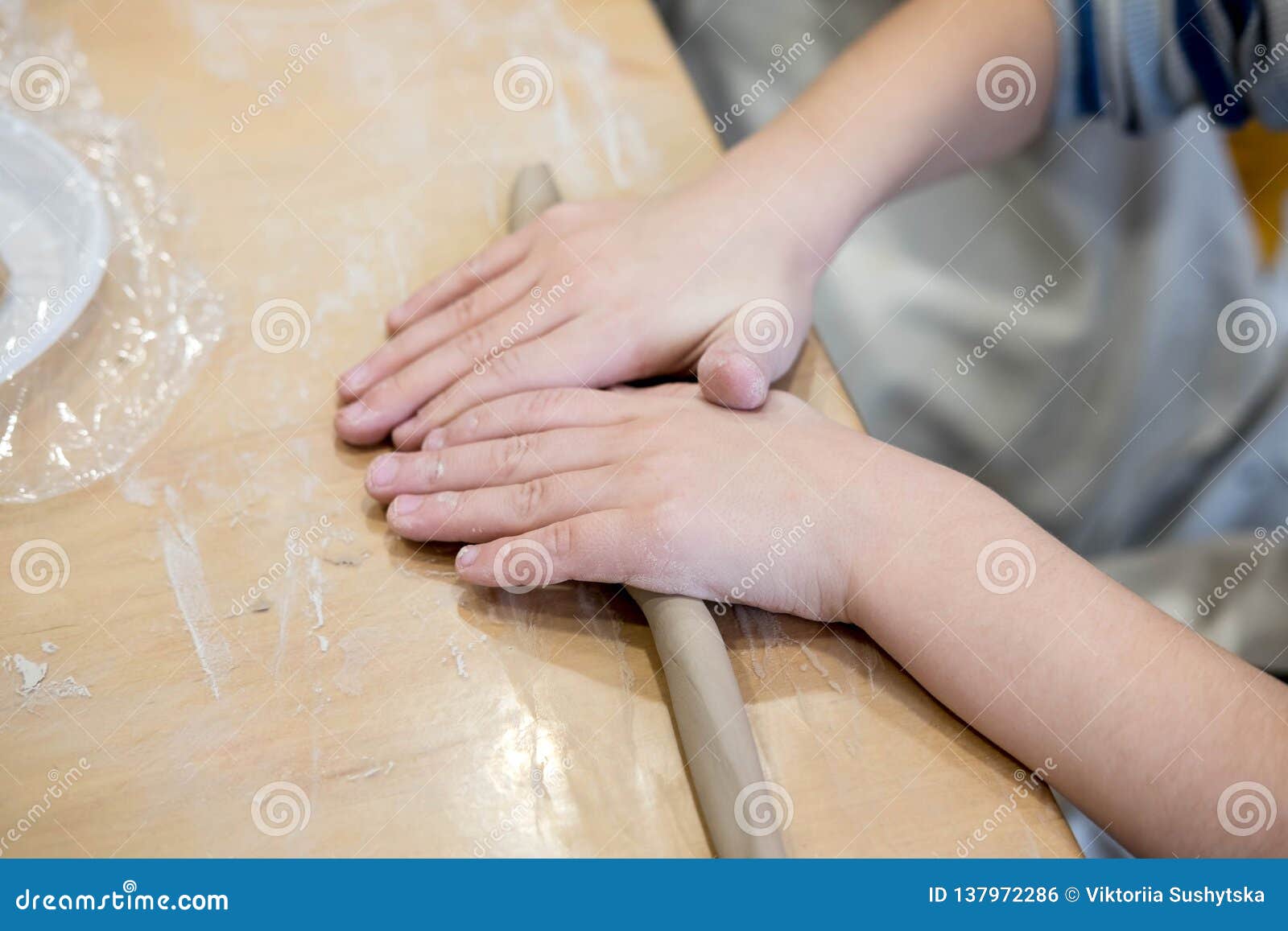 Children Hands that Mold from Clay. Children Creativity. Crafts from