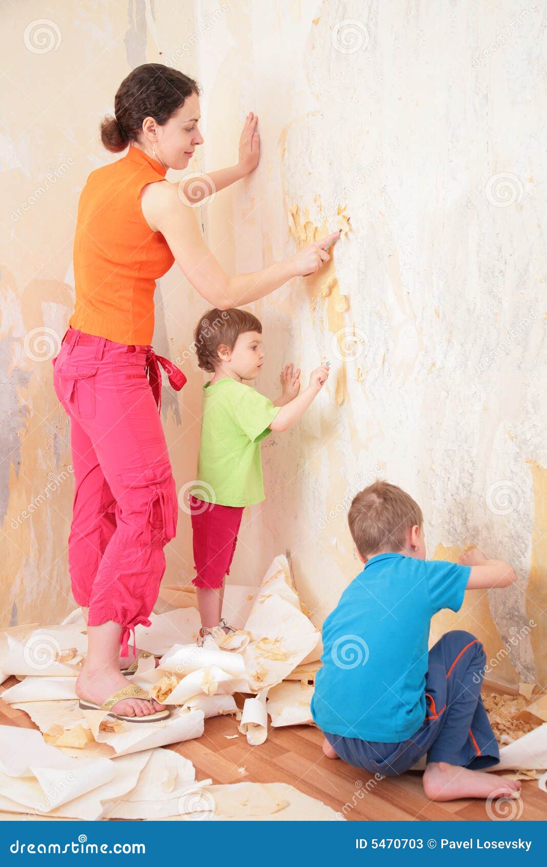 children help mother remove from wall old wallpap