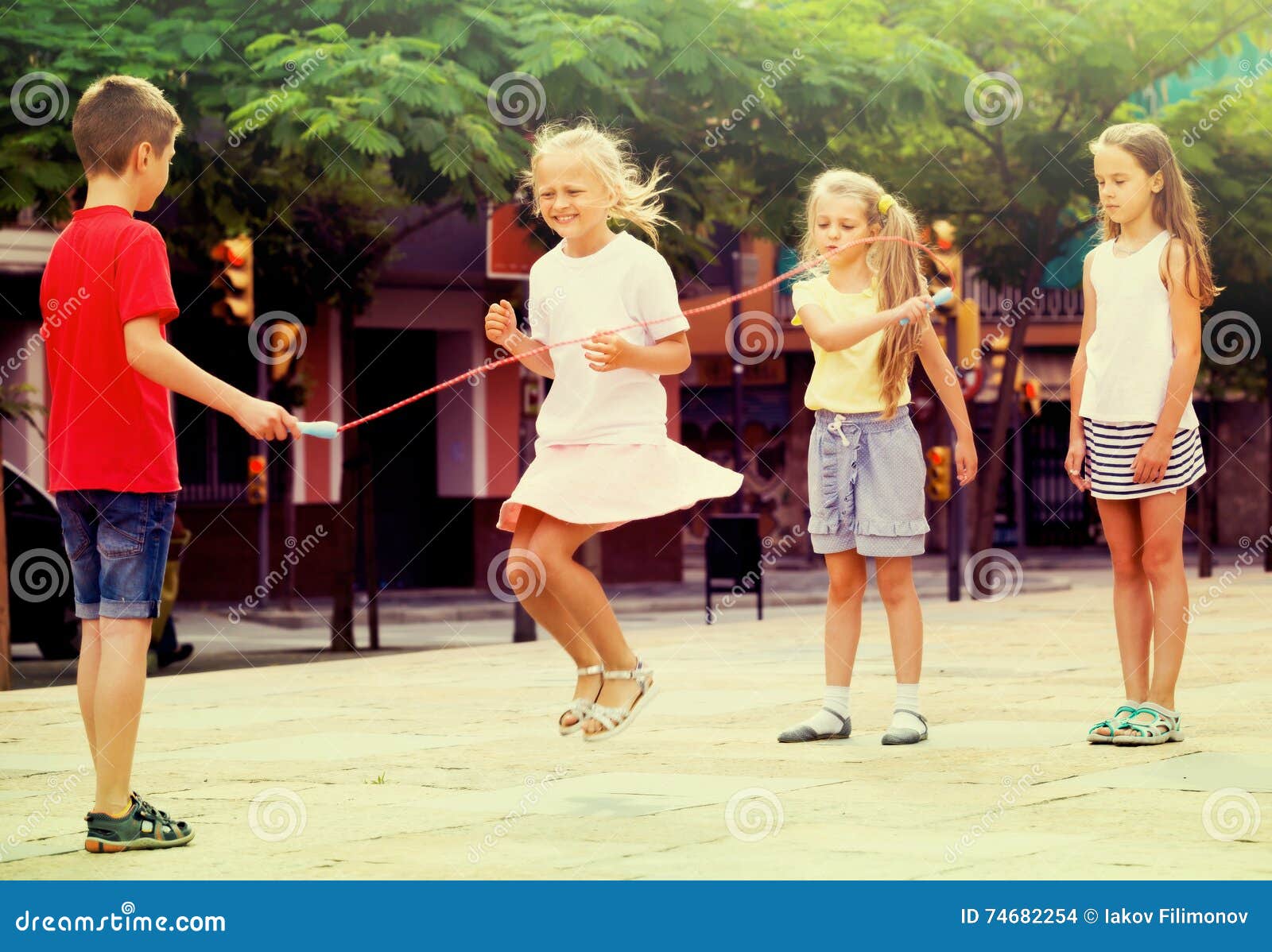 Children with Jumping Rope at Playground Stock Photo - Image of girl