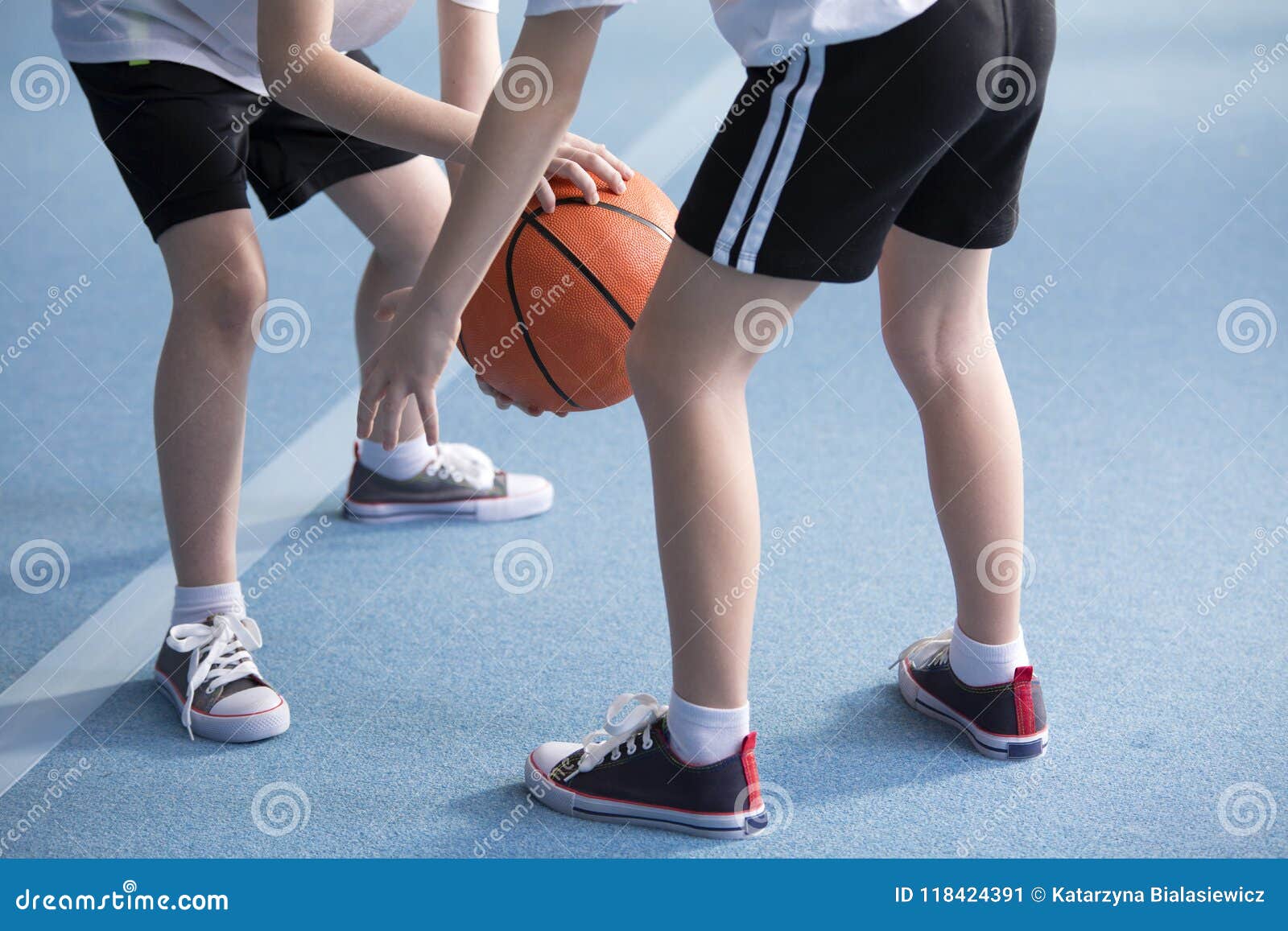 Children Learning To Dribble Basketball Stock Image