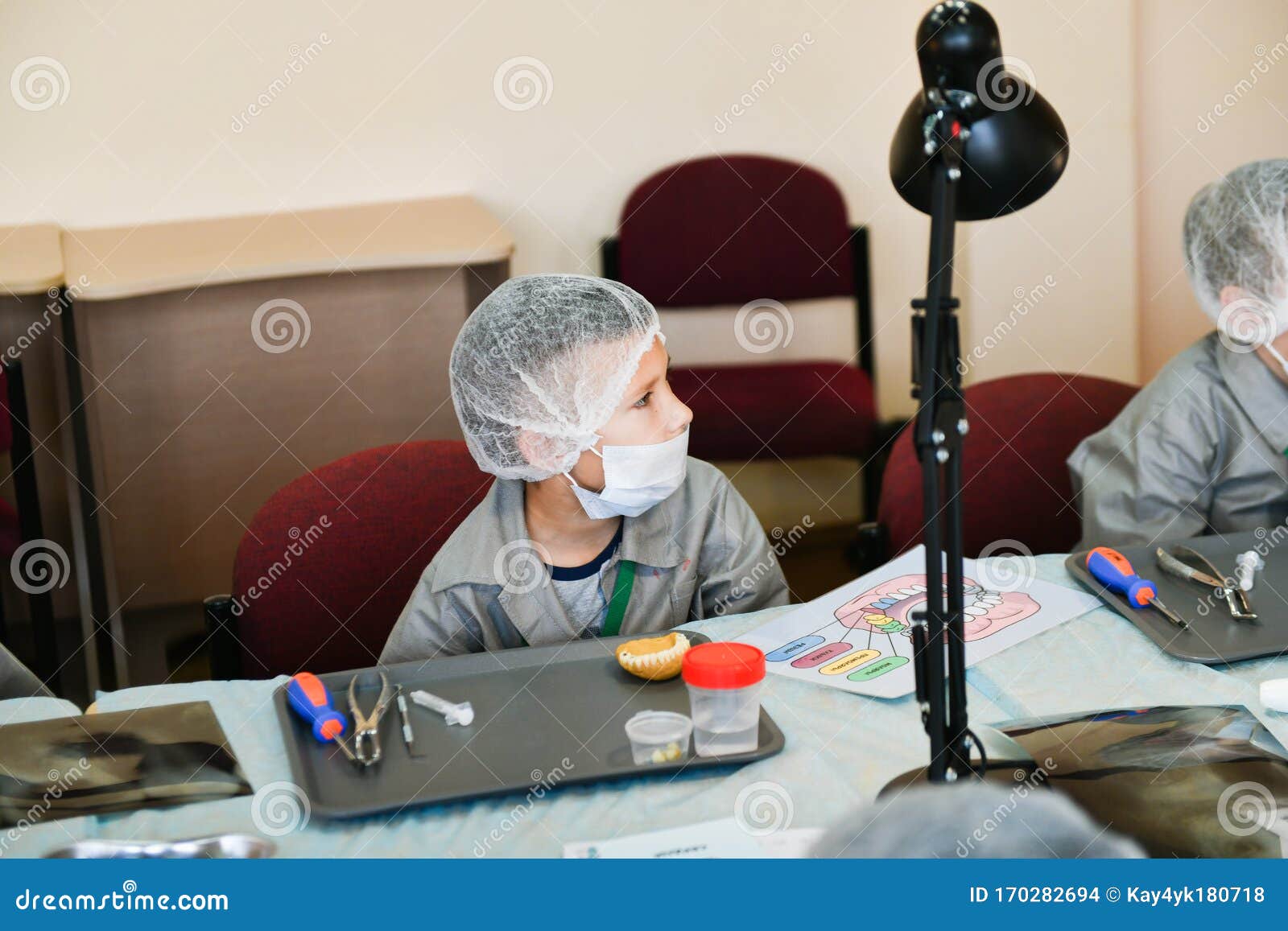 Children At The Lecture At The Dentist Training Class In Dentistry