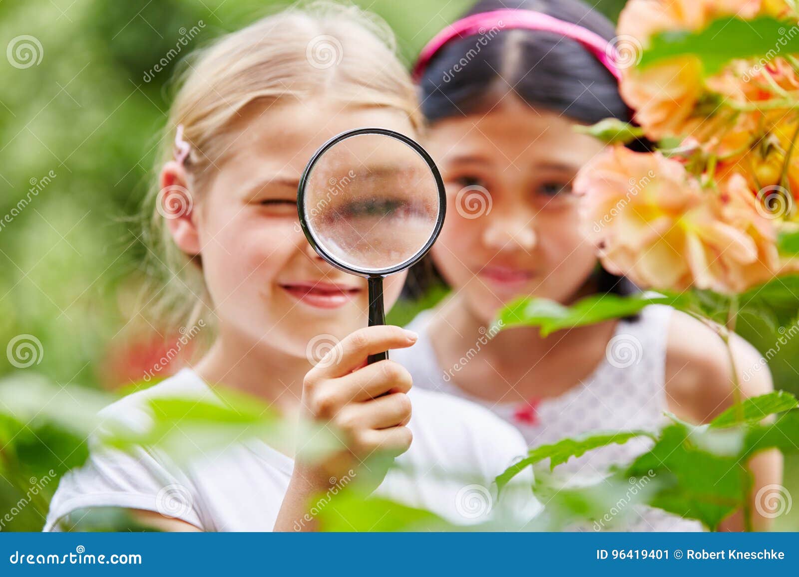 Children Looking at Flowers with Magnifying Glass Stock Image Image