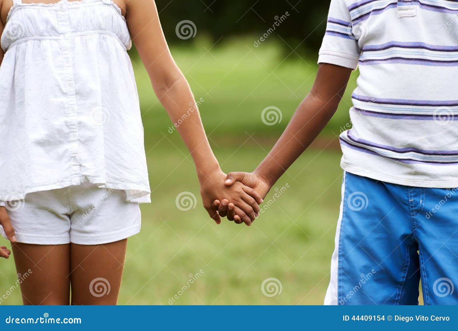 black and white kids holding hands