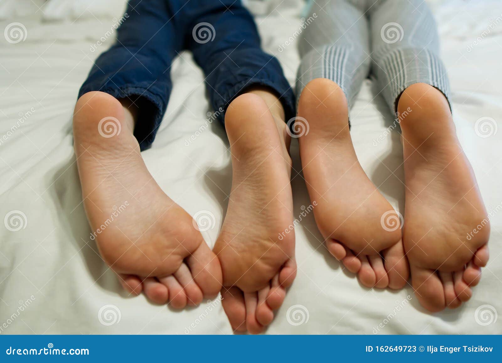Children Lying In Bed Kids Feet Close up Stock Image Image Of Health children-lying-in-bed-kids-feet-close-up-stock-image-image-of-health