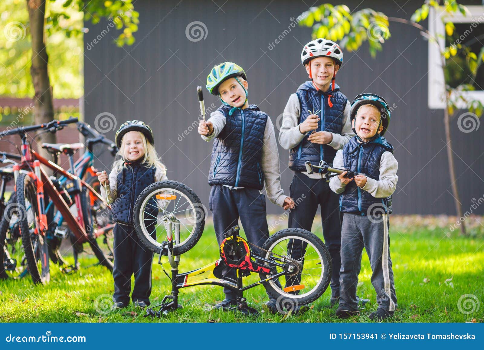 Children Mechanics, Bicycle Repair. Happy Kids Fixing Bike Together