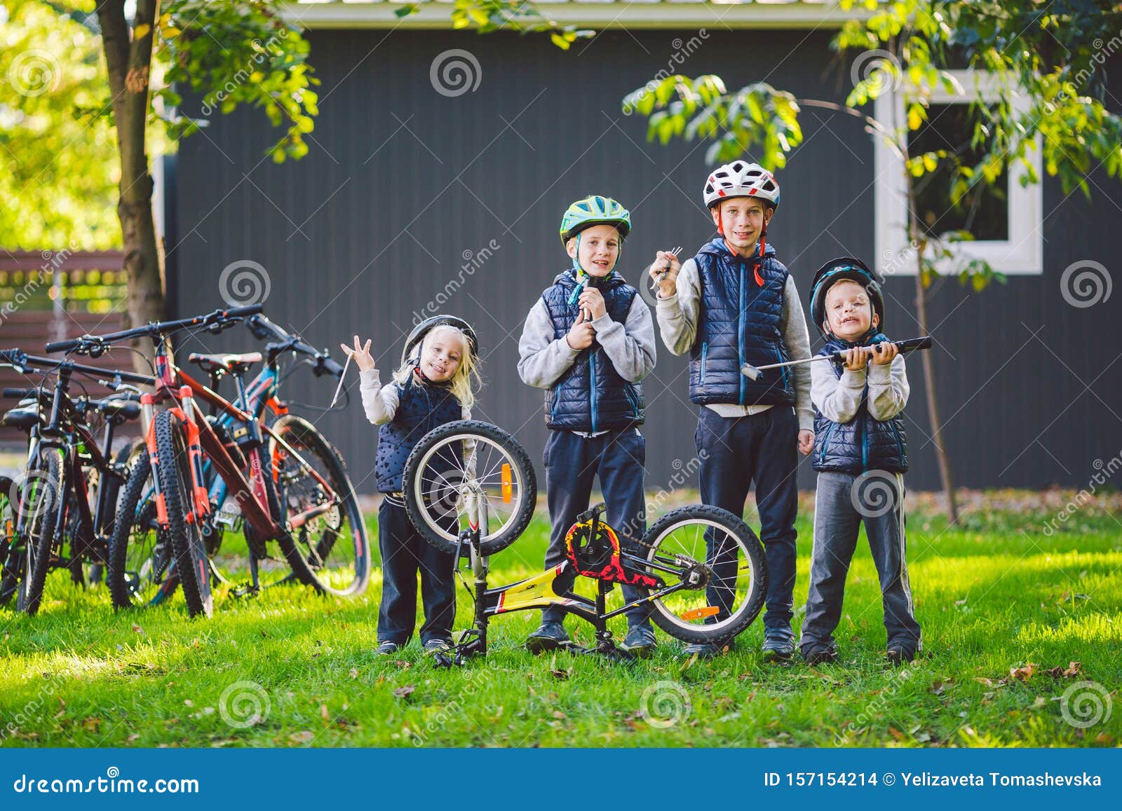 Children Mechanics, Bicycle Repair. Happy Kids Fixing Bike Together