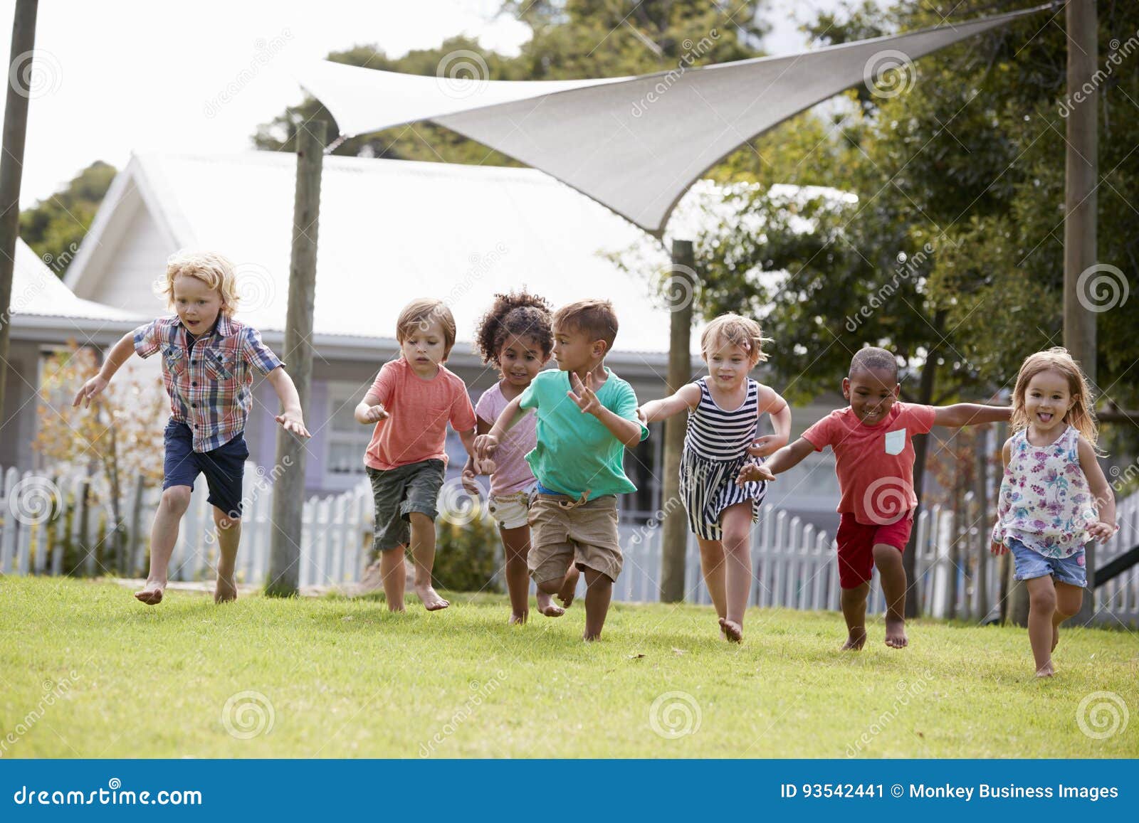 children at montessori school having fun outdoors during break