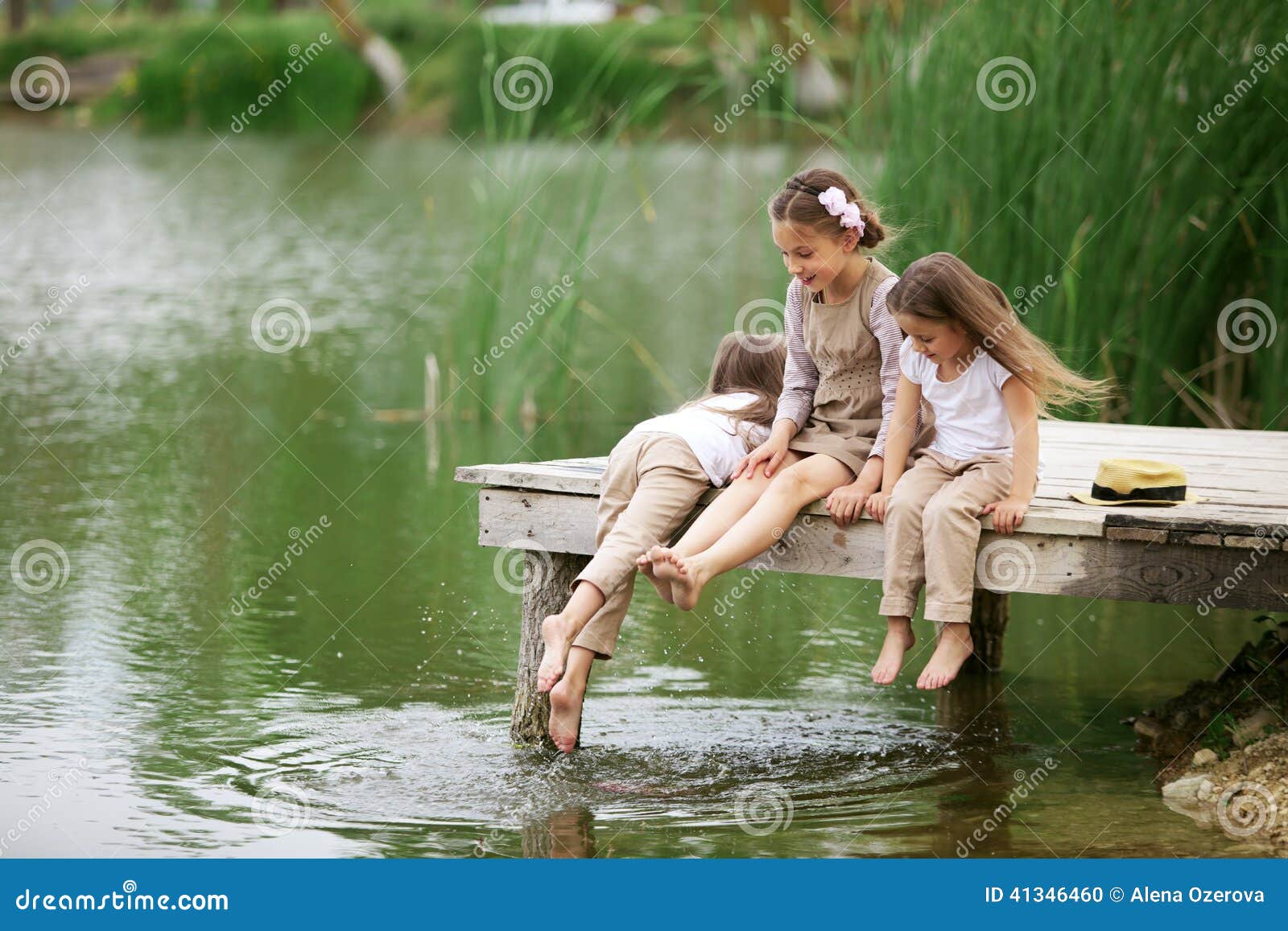Children near pond stock photo. Image of friendship, little 41346460