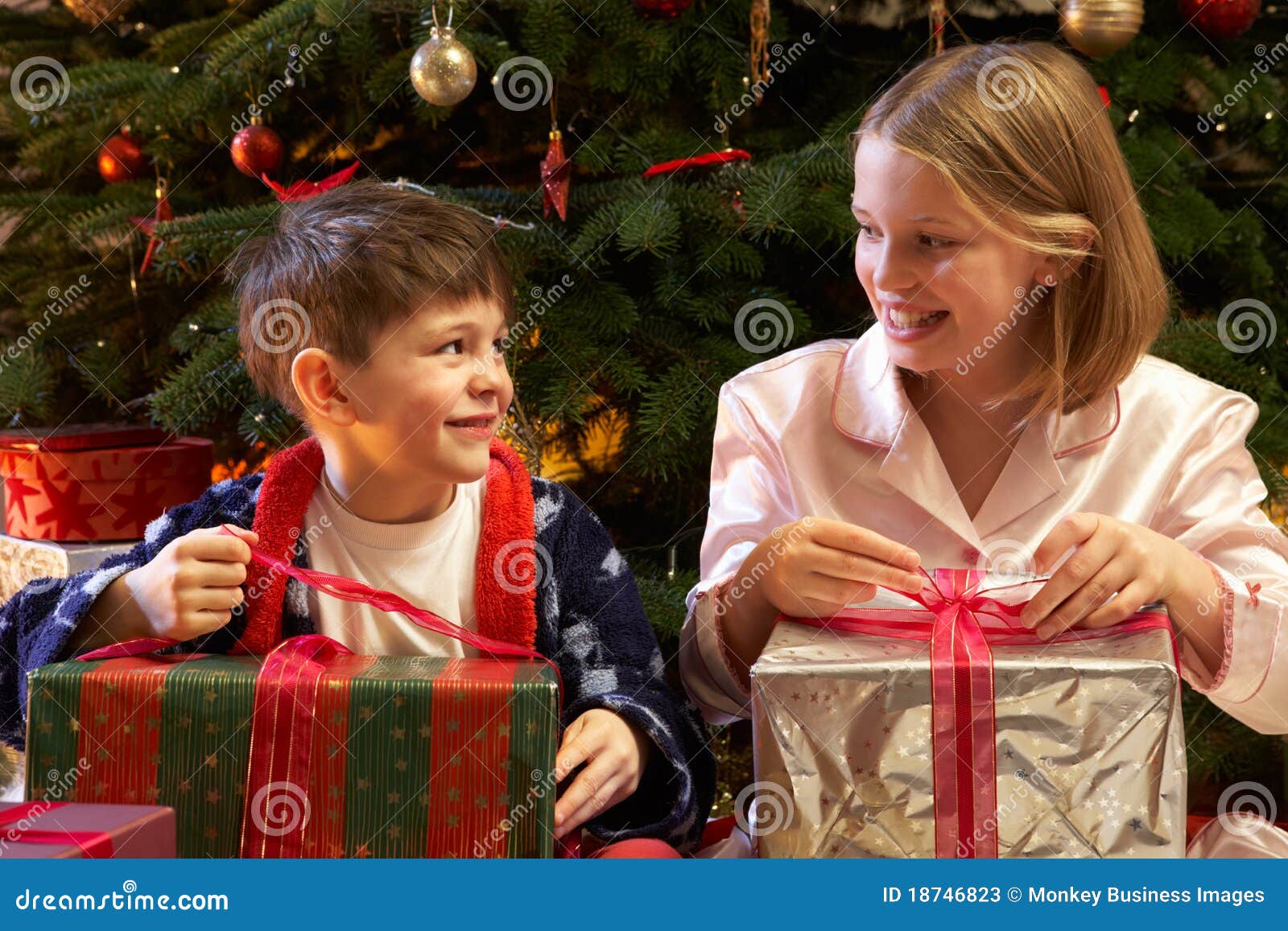 Children Opening Christmas Presents Stock Image - Image: 18746823