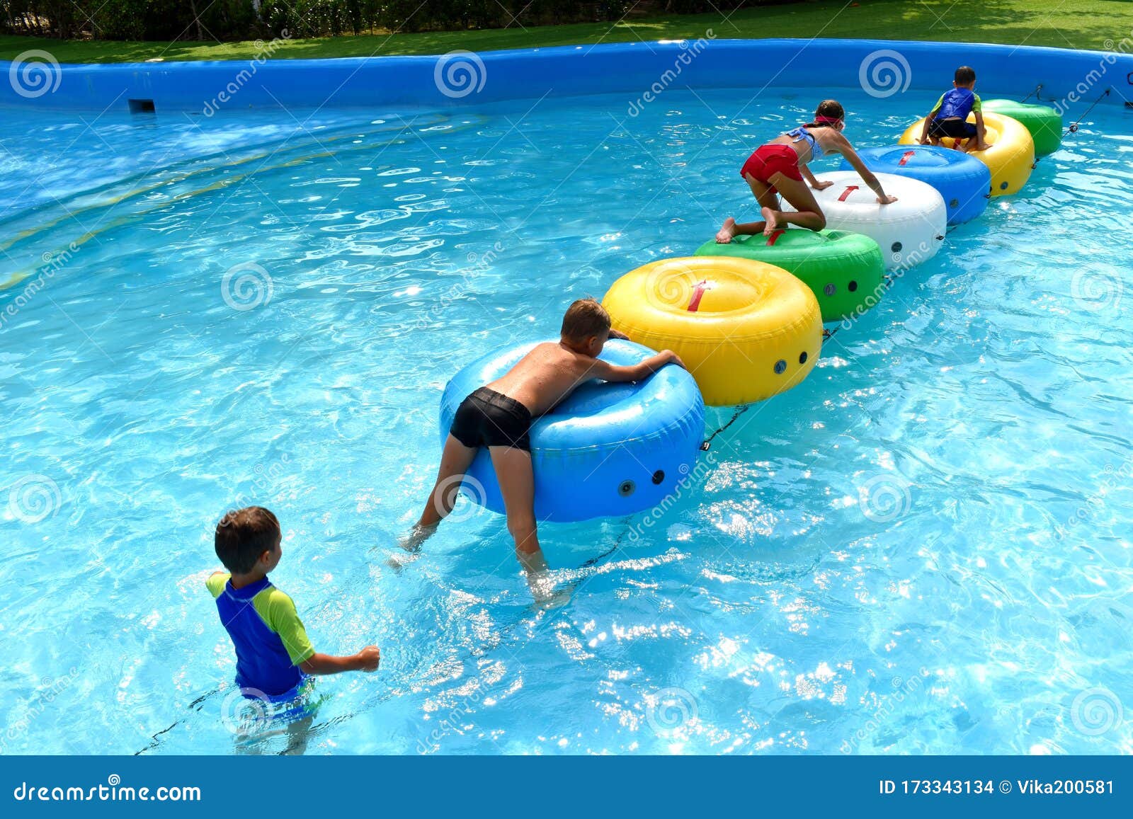 Children in the Outdoor Pool. Funny Kids at the Water Park. Happy ...