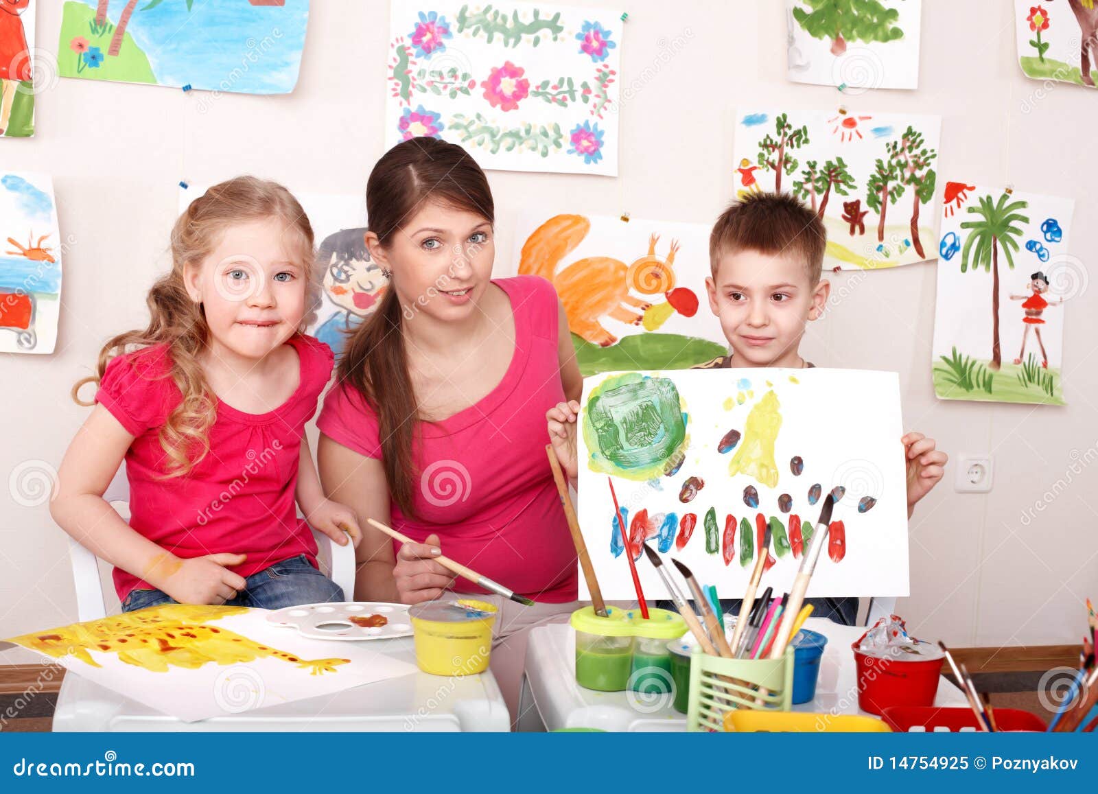 Children Painting With Teacher In Art Class. Royalty Free Stock Photo