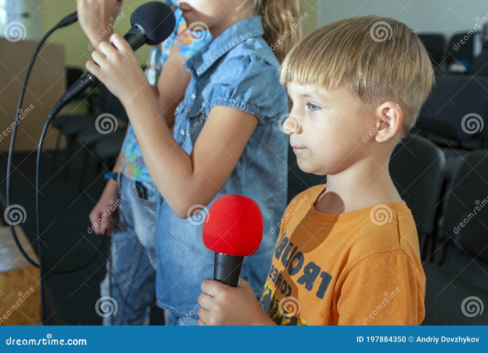 children participate with a microphone, recite poems, recitation