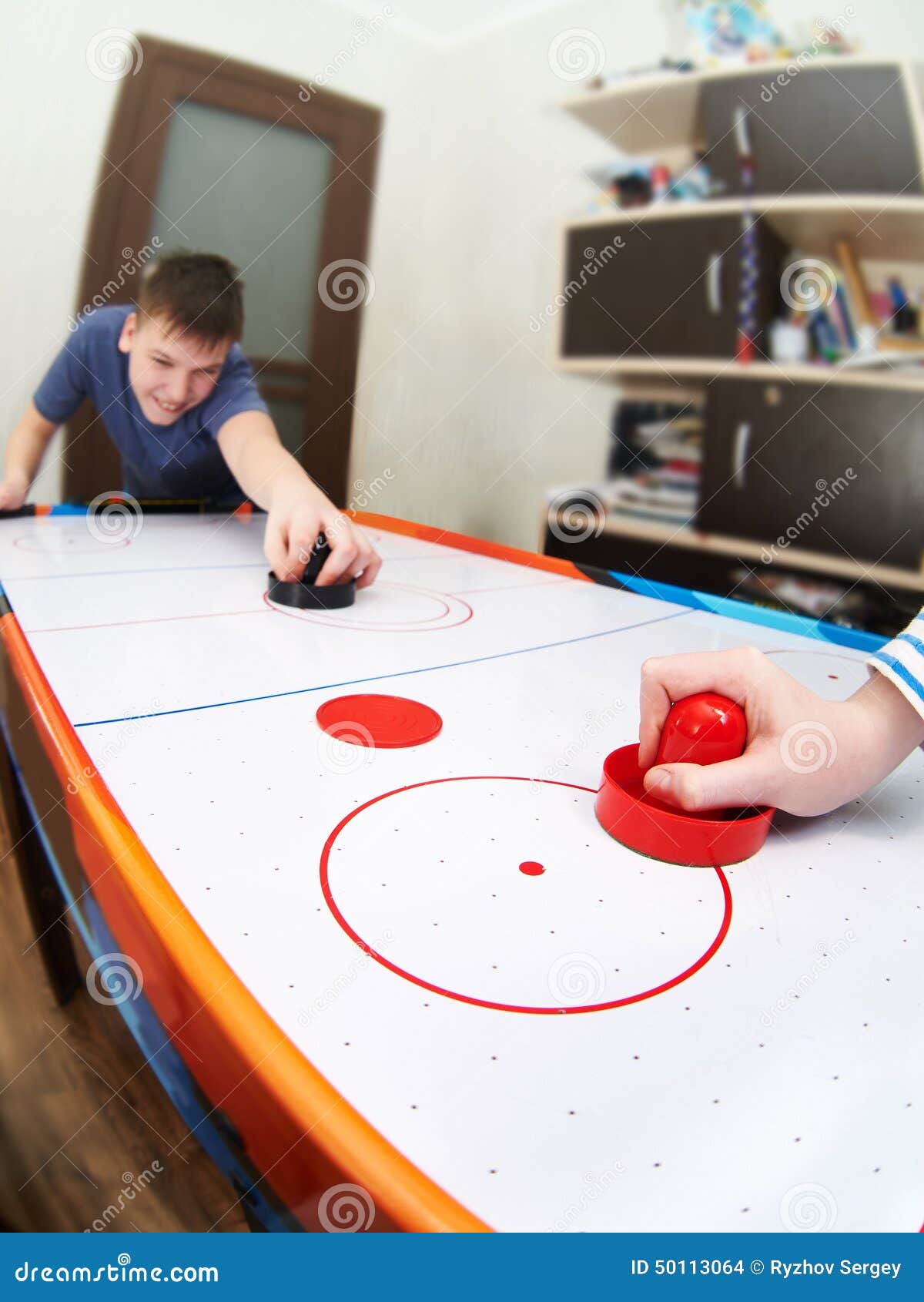 Children Playing on Air Hockey Stock Photo Image of playing, disc